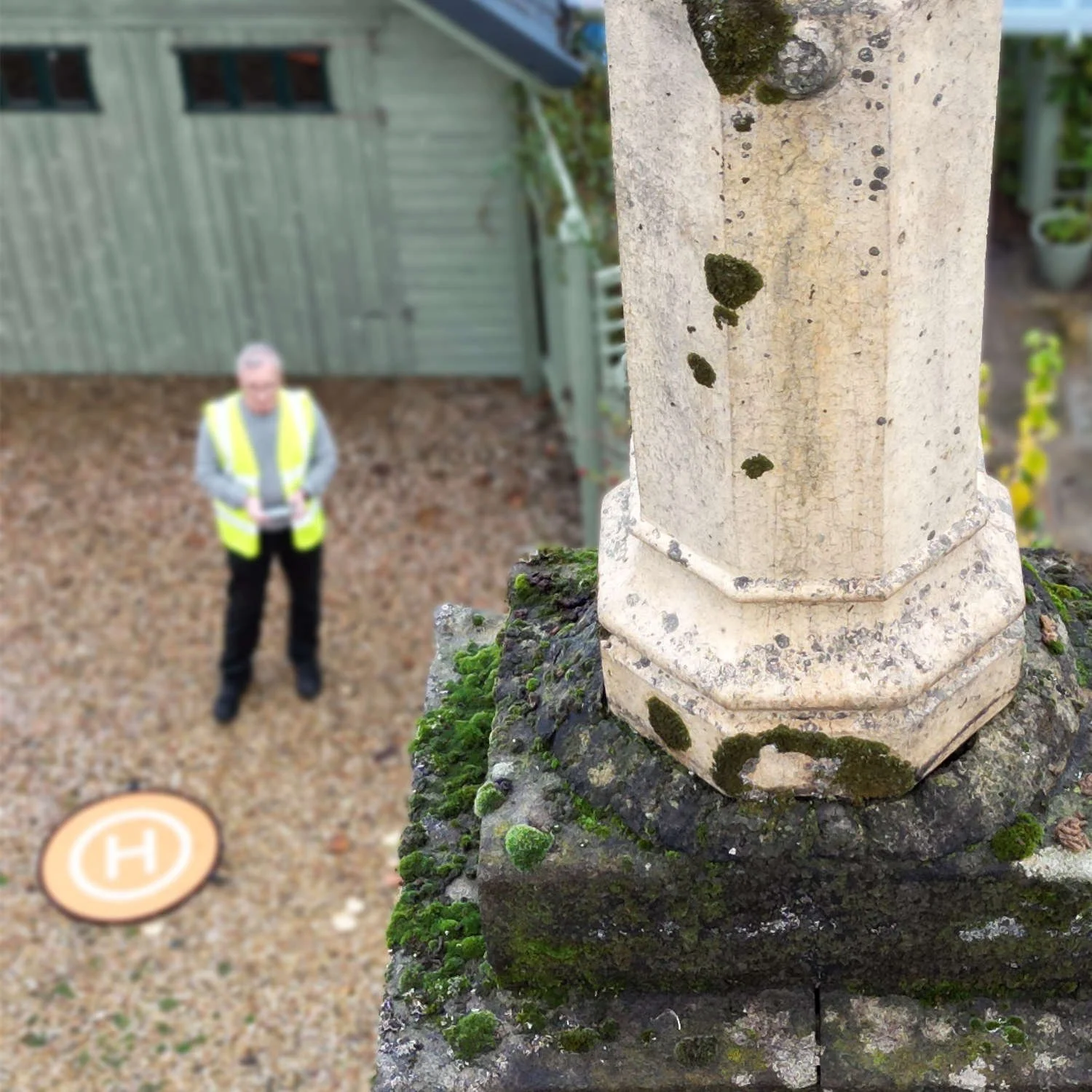 surveyor inspecting a chimney with a drone