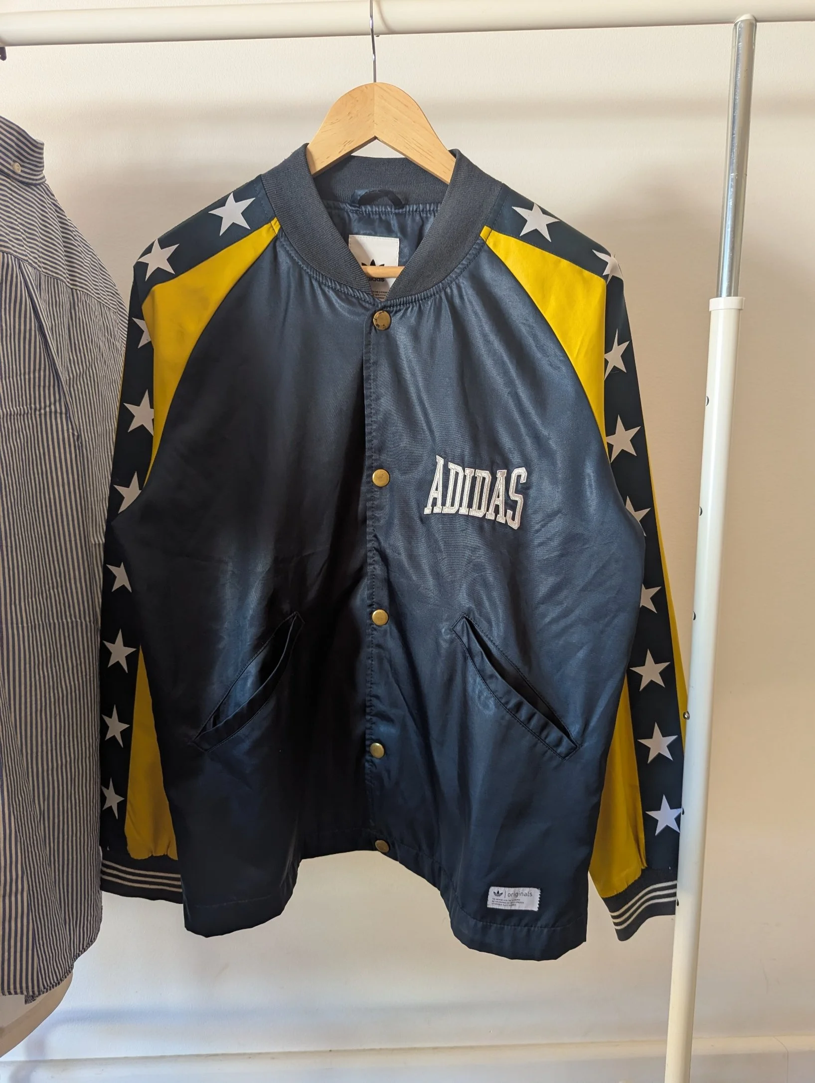 Adidas Originals 1974 Satin Bomber Jacket in navy and yellow with a star pattern