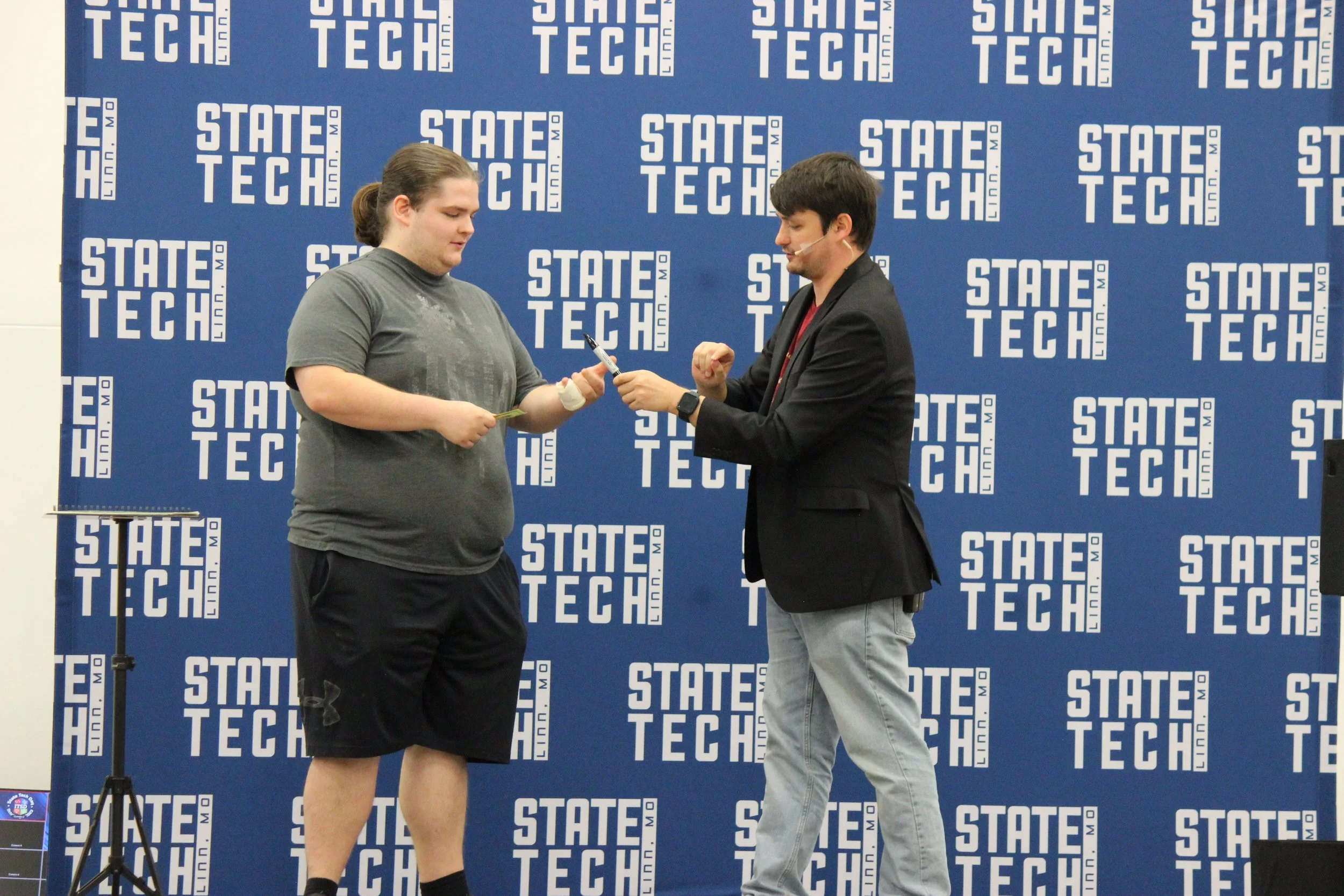 Sales kickoff entertainment: magician Josh Weidner performing a comedy magic show for a sales team