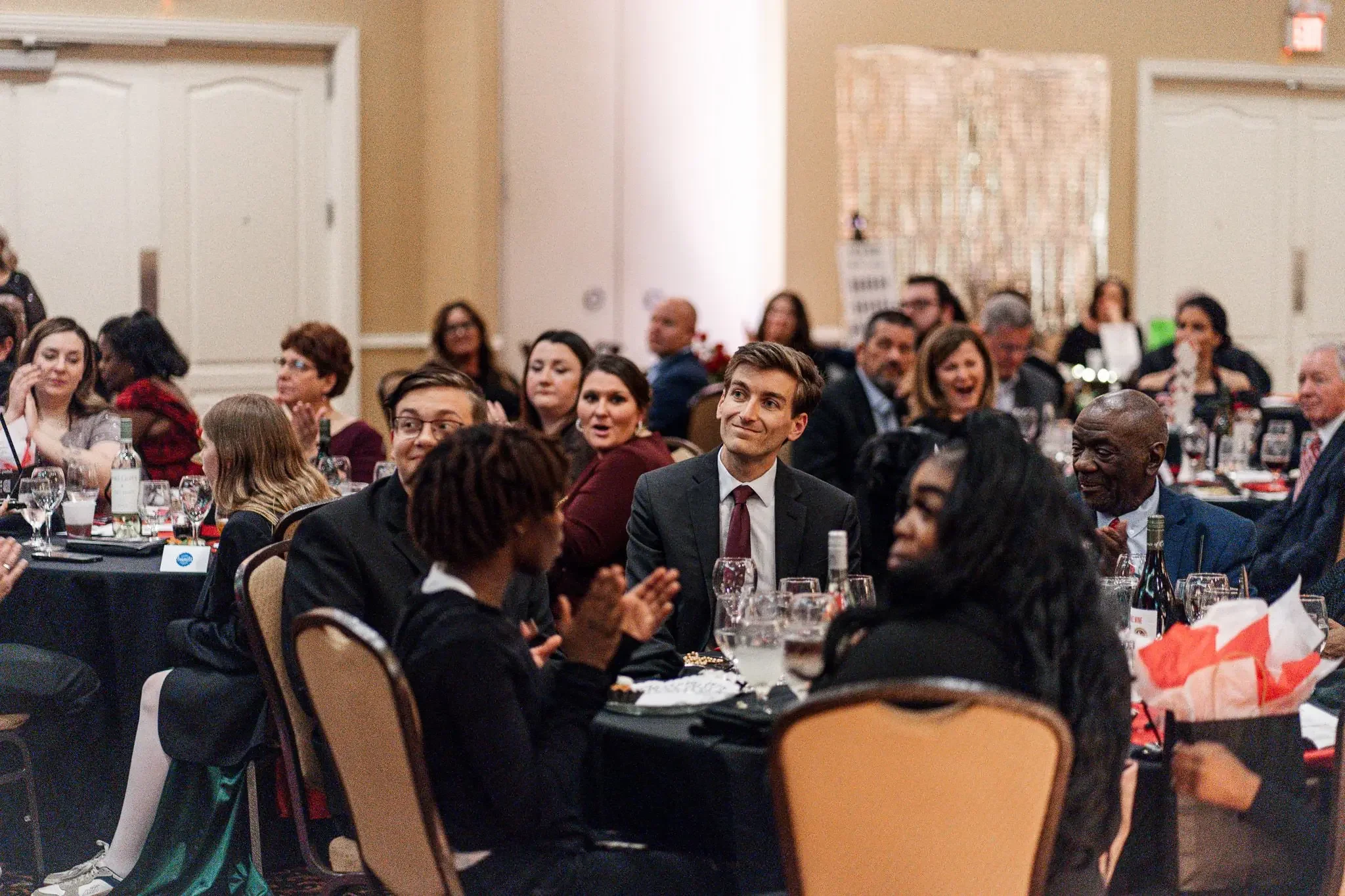 Strolling magician Josh Weidner performing close-up card magic for event guests