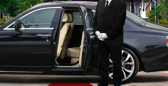 chauffeur waiting with door open new.express.adobe.com.jpeg