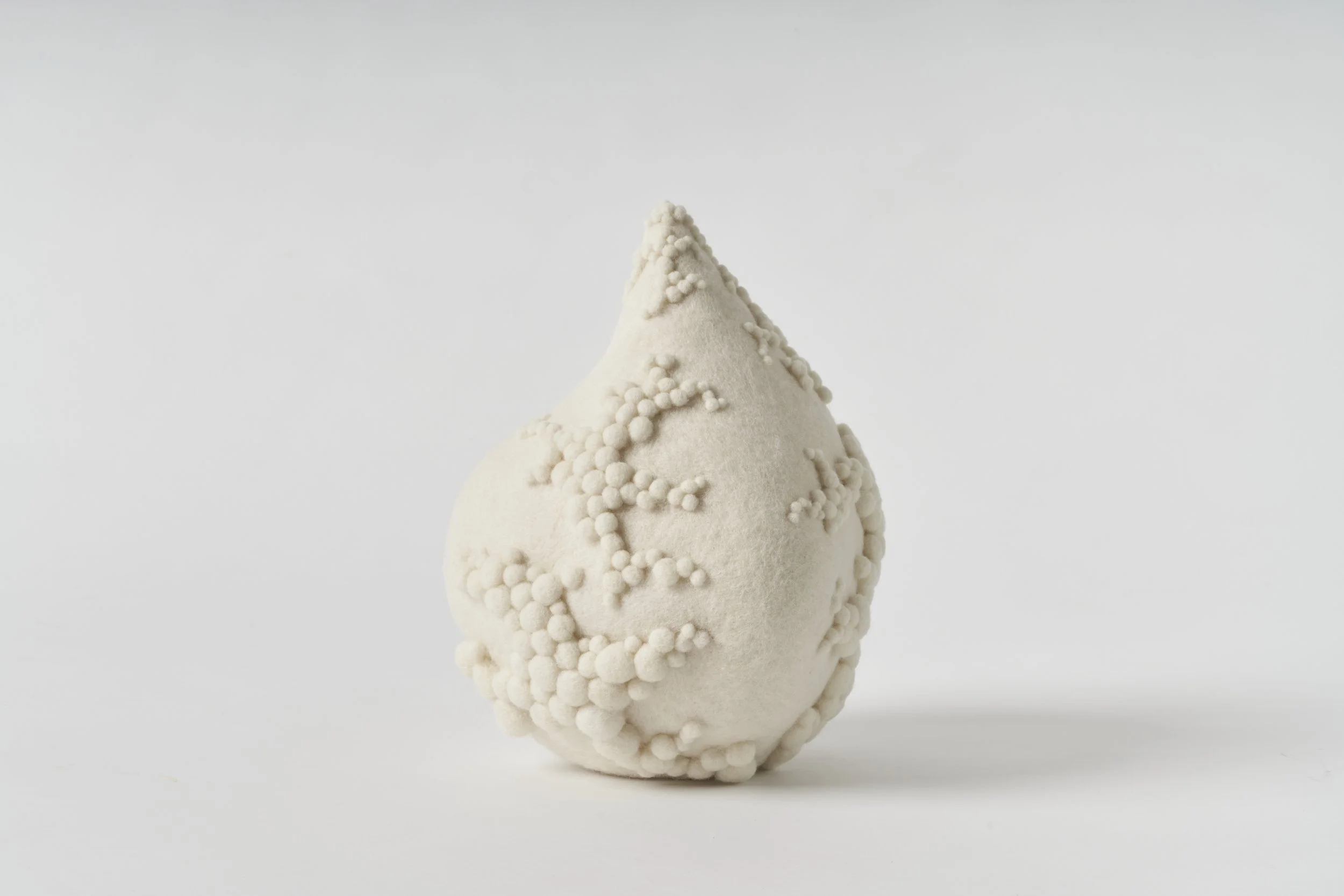 'Gather', 2025, wool fibre, felt, thread, 20 x 21 x 28cm. [Private Collection]. Image: Sam Roberts