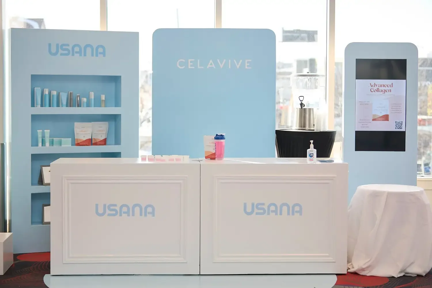 A photo of a sponsor's booth at a corporate event in Montreal.