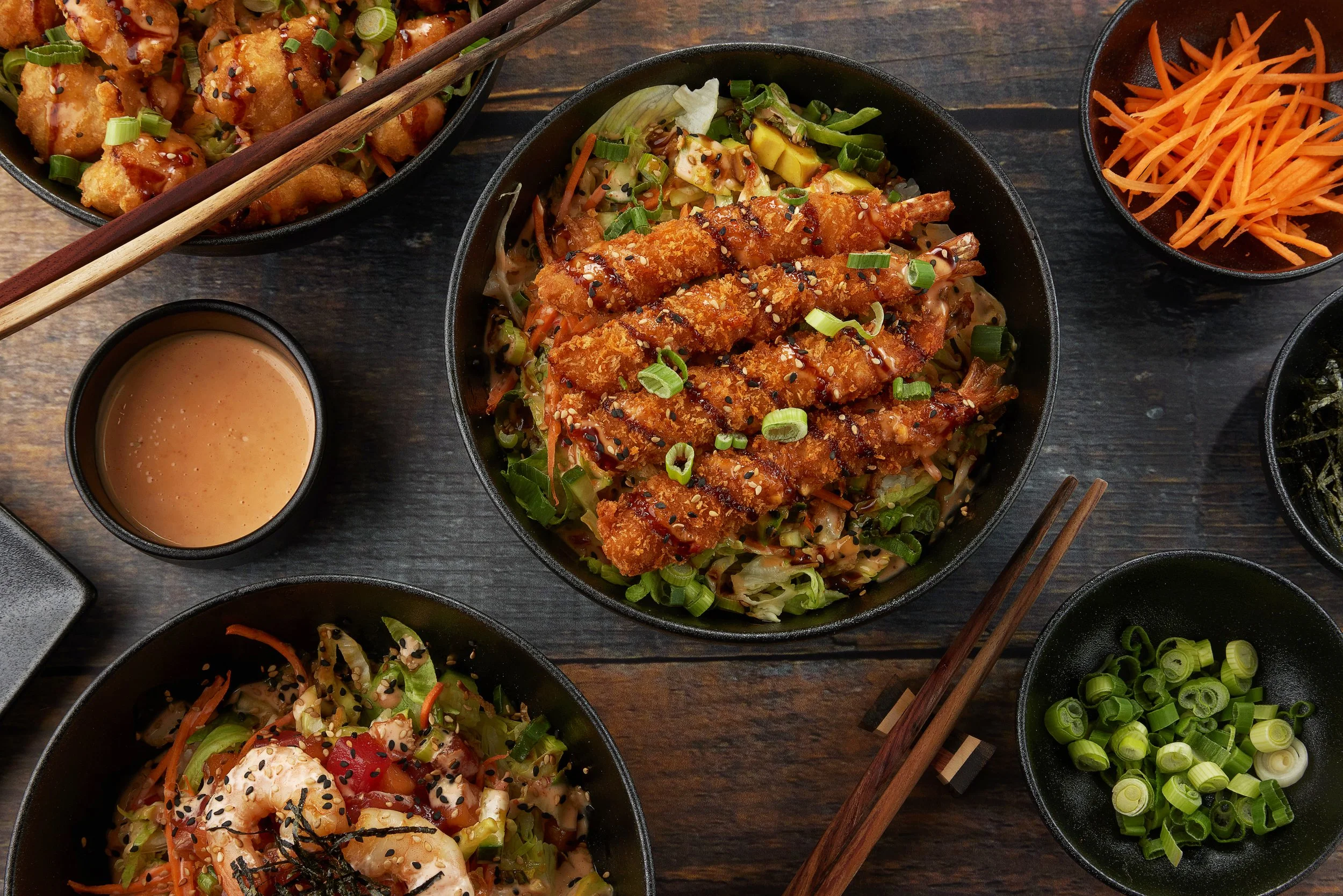 Poké bowls on a table.