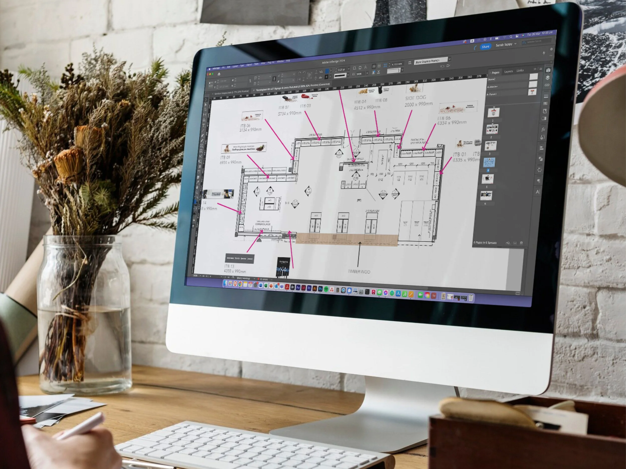 Desktop computer with CAD drawings of a Godfreys store design