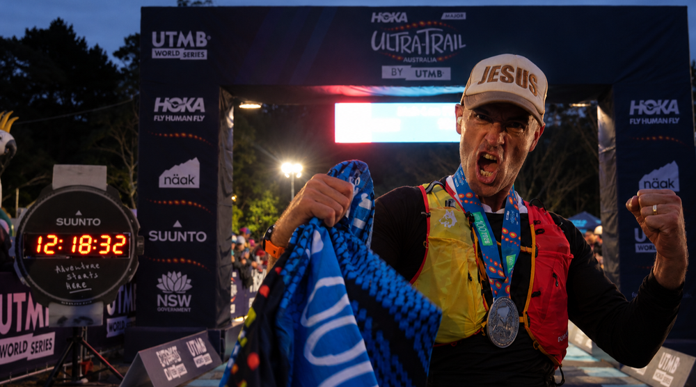 Coach Wayne Calvert finishing the UTA100K by UTMB