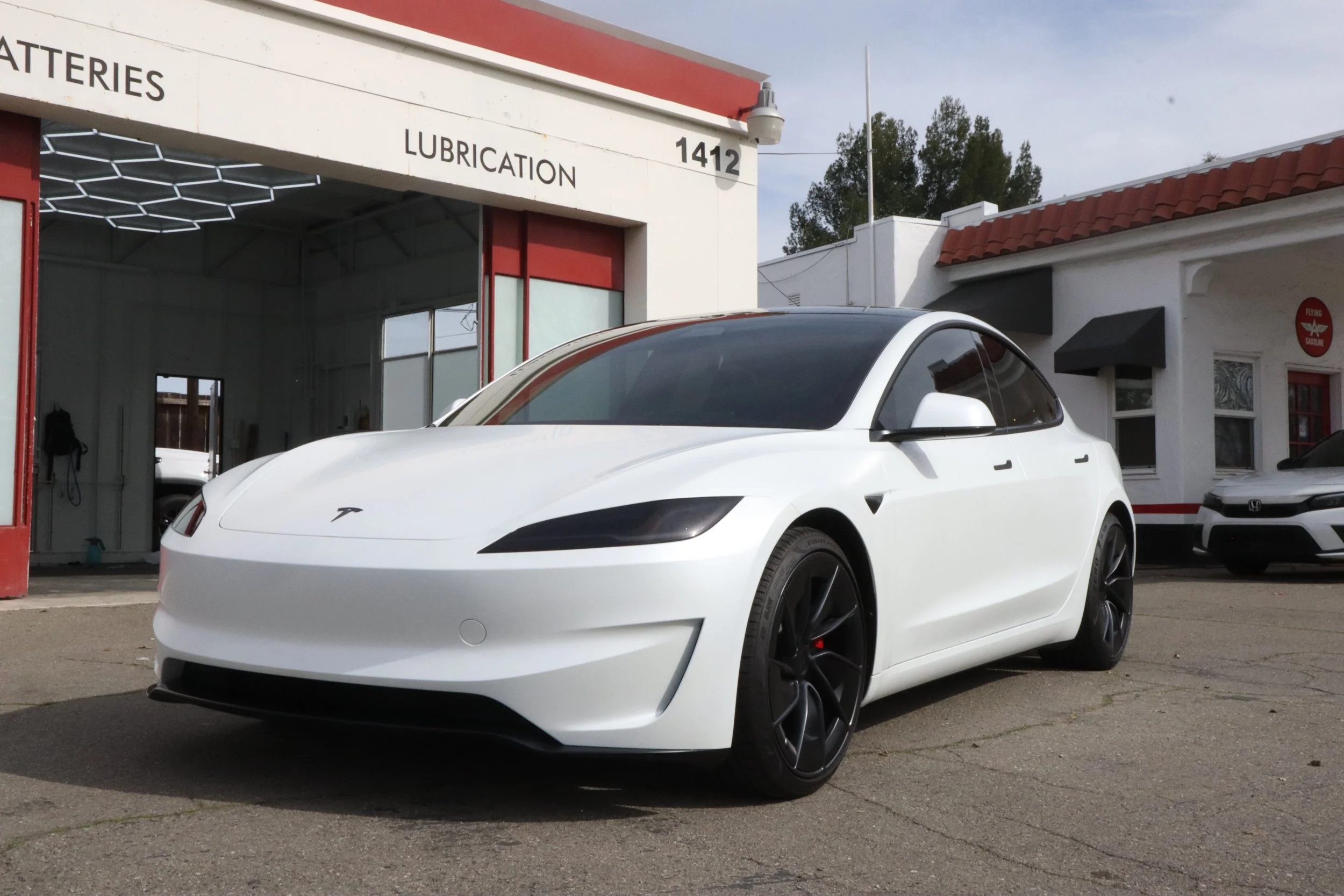 White Stealth clear satin / matte Paint Protection Film wrapped Tesla Model 3 outside SosaaTintz detailing and PPF shop at 1414 Portola Ave Livermore CA 94551
