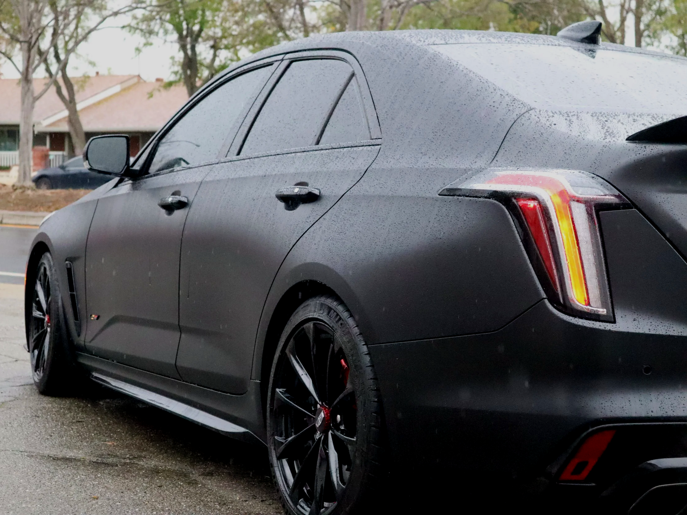 Ceramic coated black car with water beading after detail, Colored Paint Protection Film CT4 Blackwing V in Livermore CA