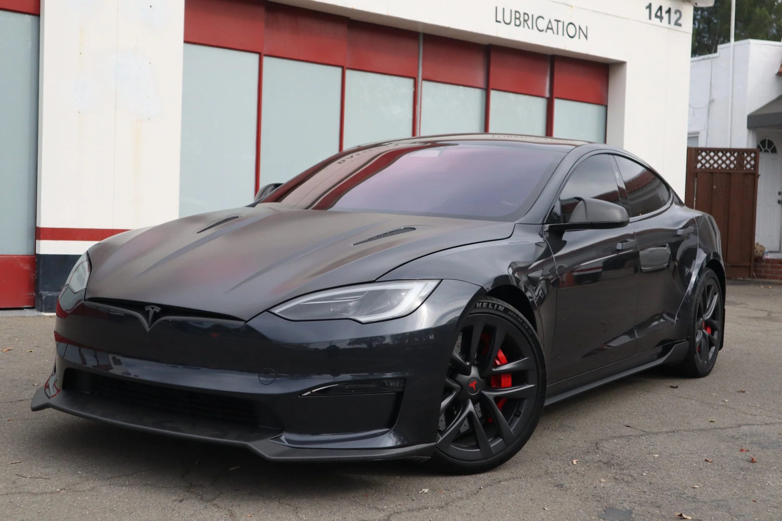 Black Tesla Model S featuring ceramic window tint and stealth satin / matte paint protection film (PPF) installed by SosaaTintz in Livermore, California.
