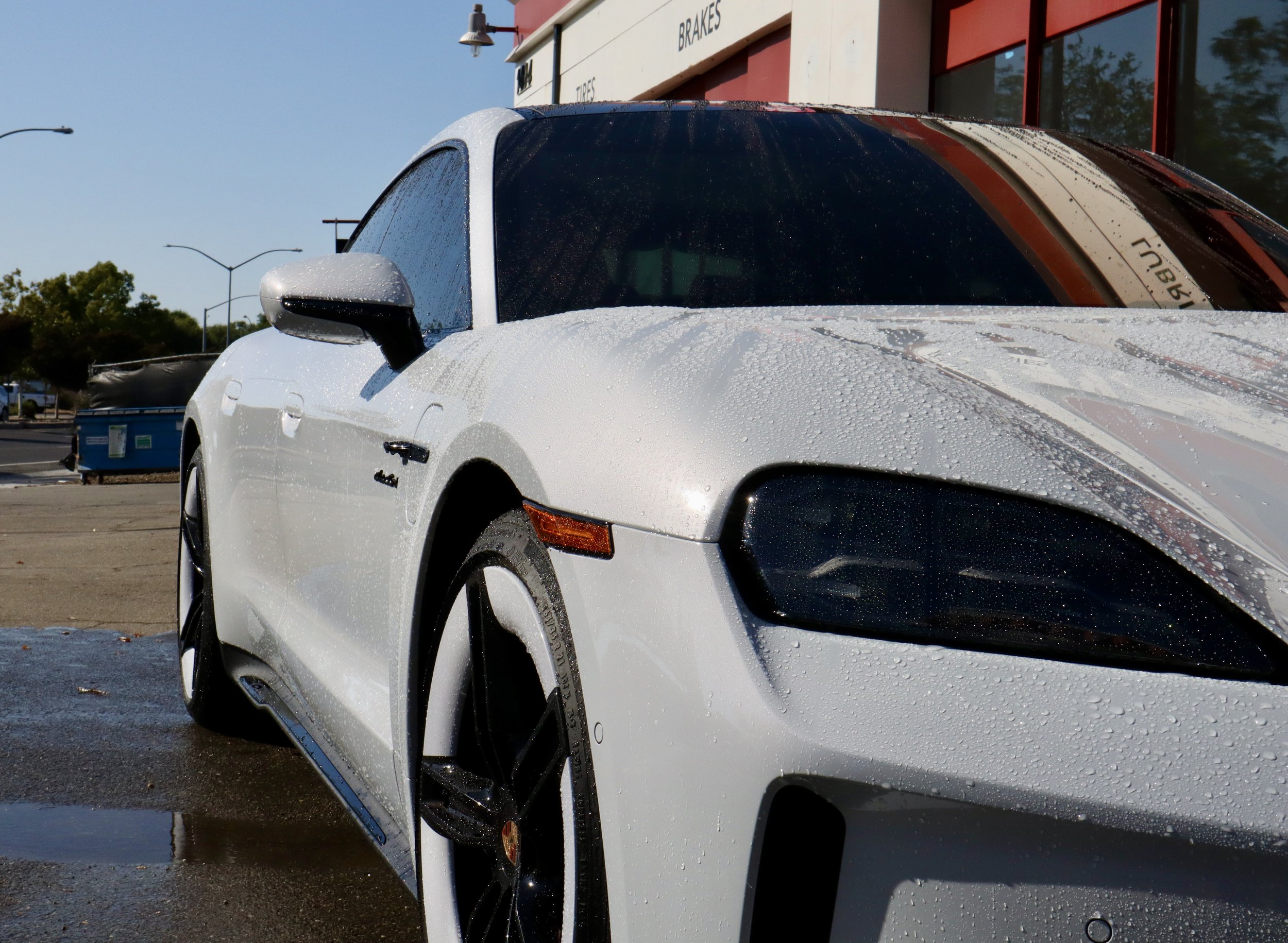 White Porsche Taycan with ceramic coating and water beading in Livermore, CA
