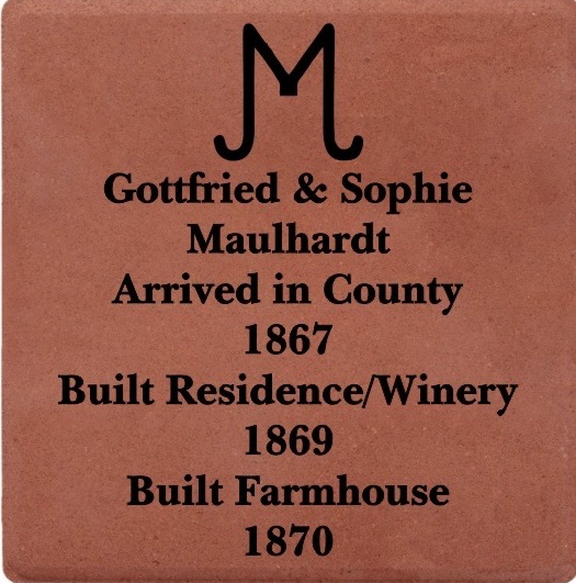 Historical plaque detailing the life of Gottfried & Sophie Maulhardt, who arrived in County in 1867, built a residence and winery in 1869, and a farmhouse in 1870.