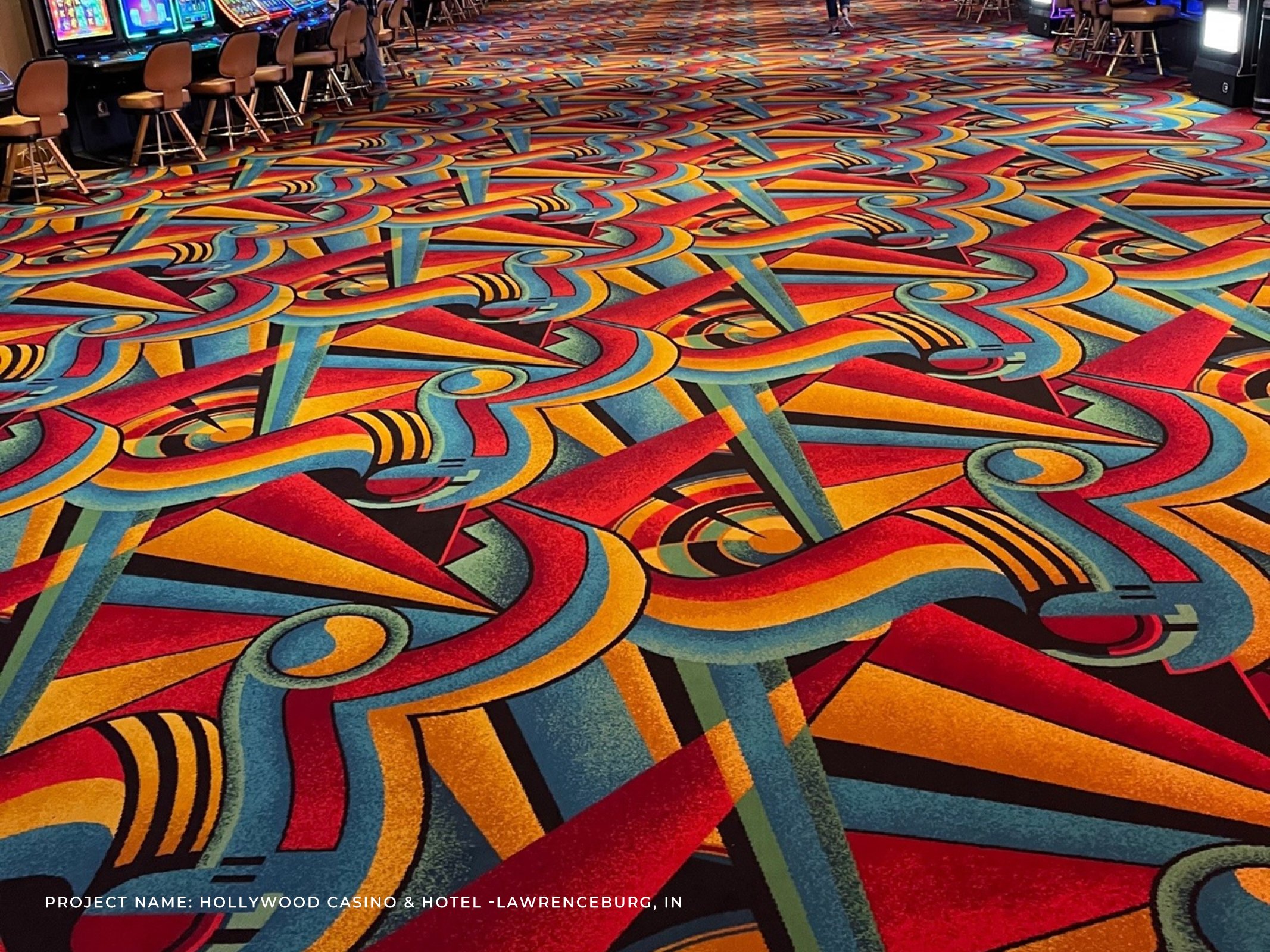 Bold teal, yellow and red Axminster carpet tile design for casino floor.