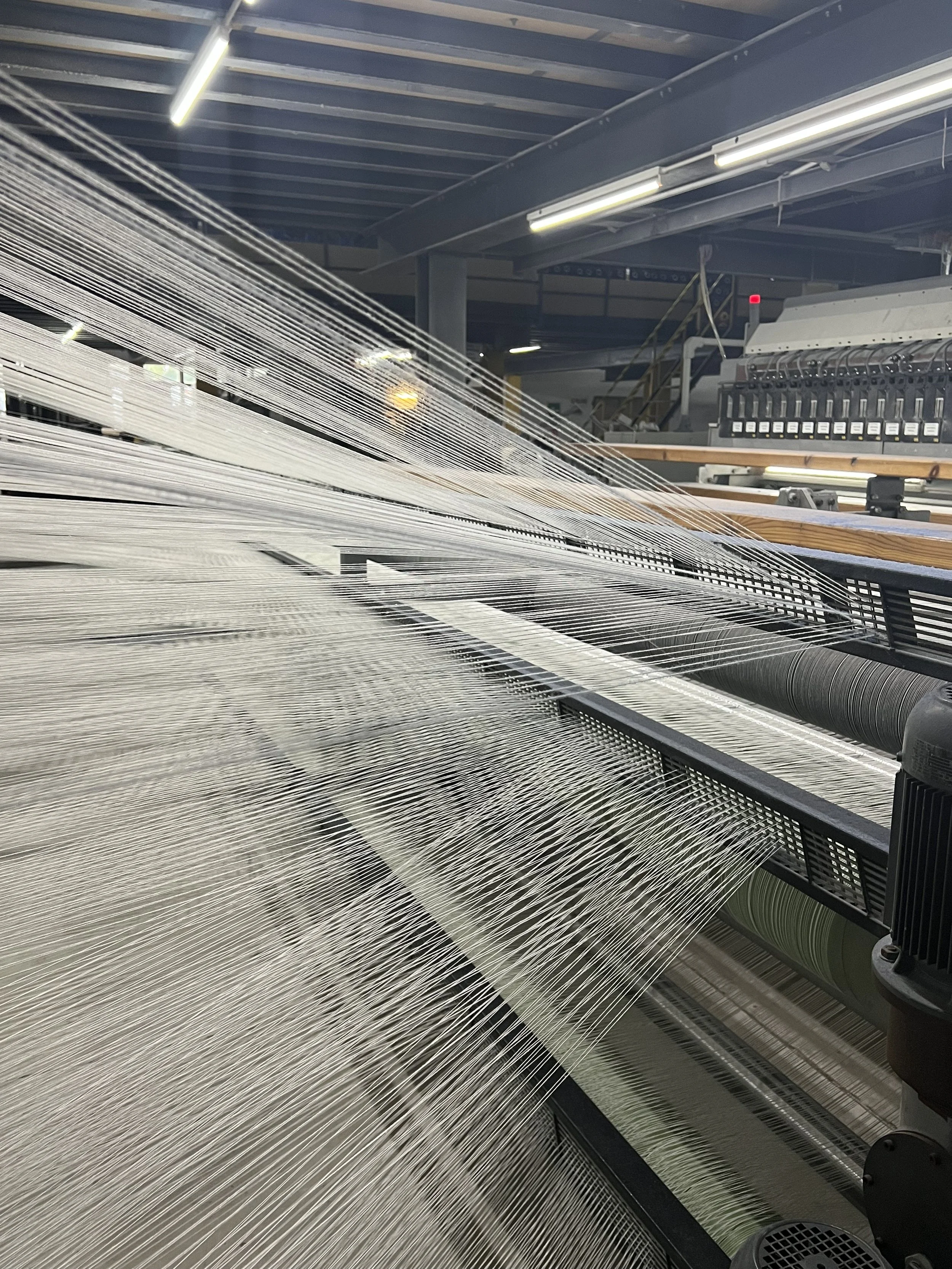 Yarn on an Axminster carpet loom.