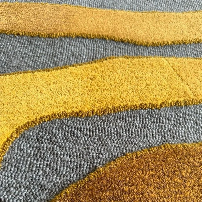 Gold and gray handtufted sample.