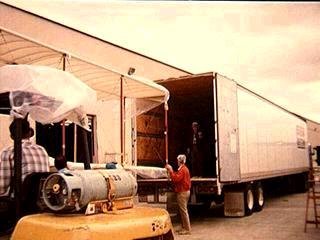Loading our Flyer into the moving van. The forklift held position while the moving van was backed into the airplane!