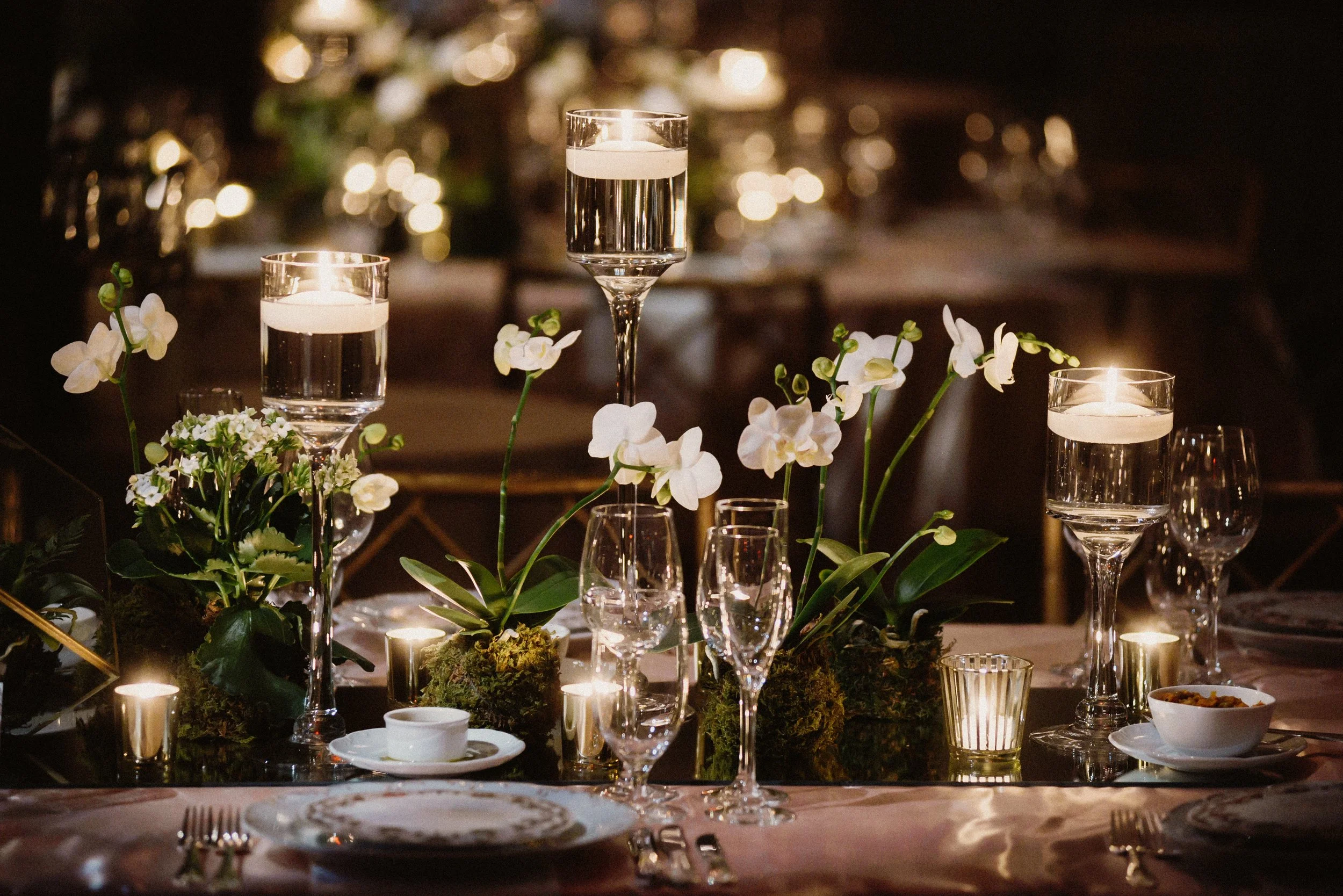 decorated-table-with-orchids-candles-glasses-light.jpg