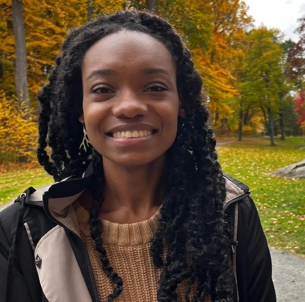 Chandra Marshall outside amongst fall leaves