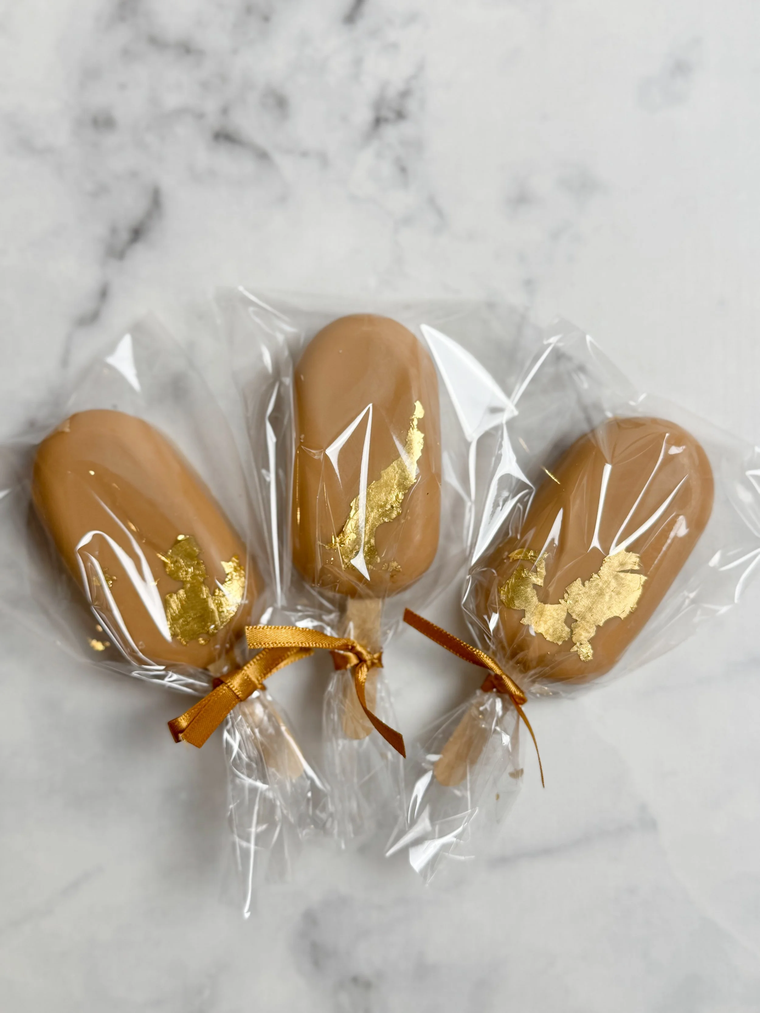 Elegant Cakesicle with gold leaf