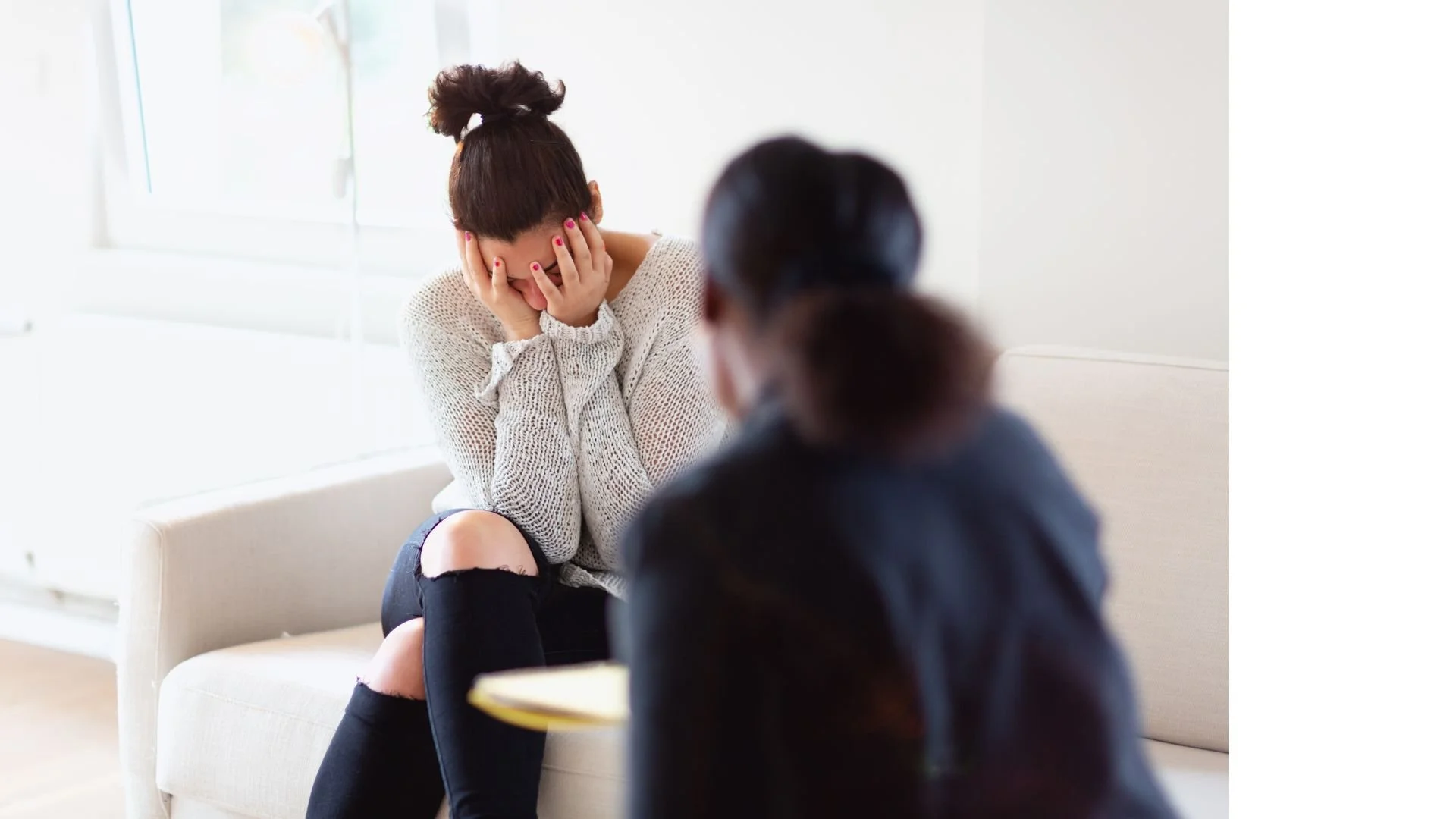 A woman listening to a teen girl.