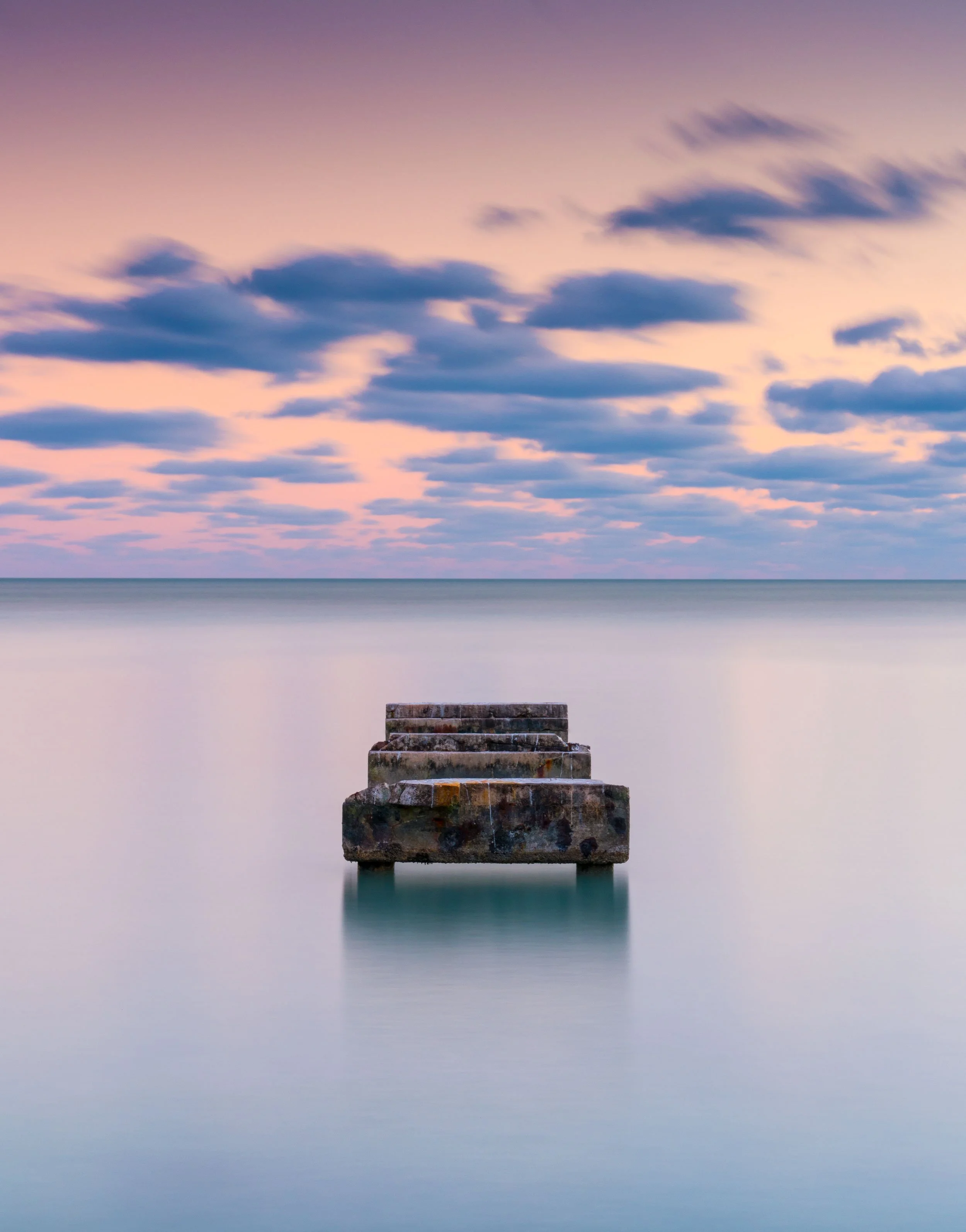 Minimalist long-exposure seascape reducing horizon and color to abstract form