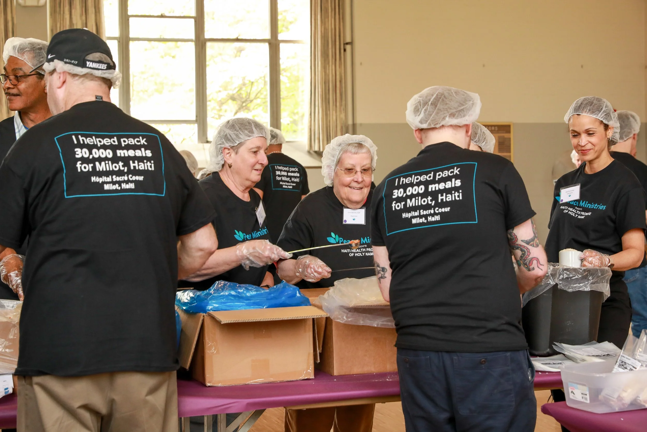 Ministries Gather to Pack 30,000 Meals