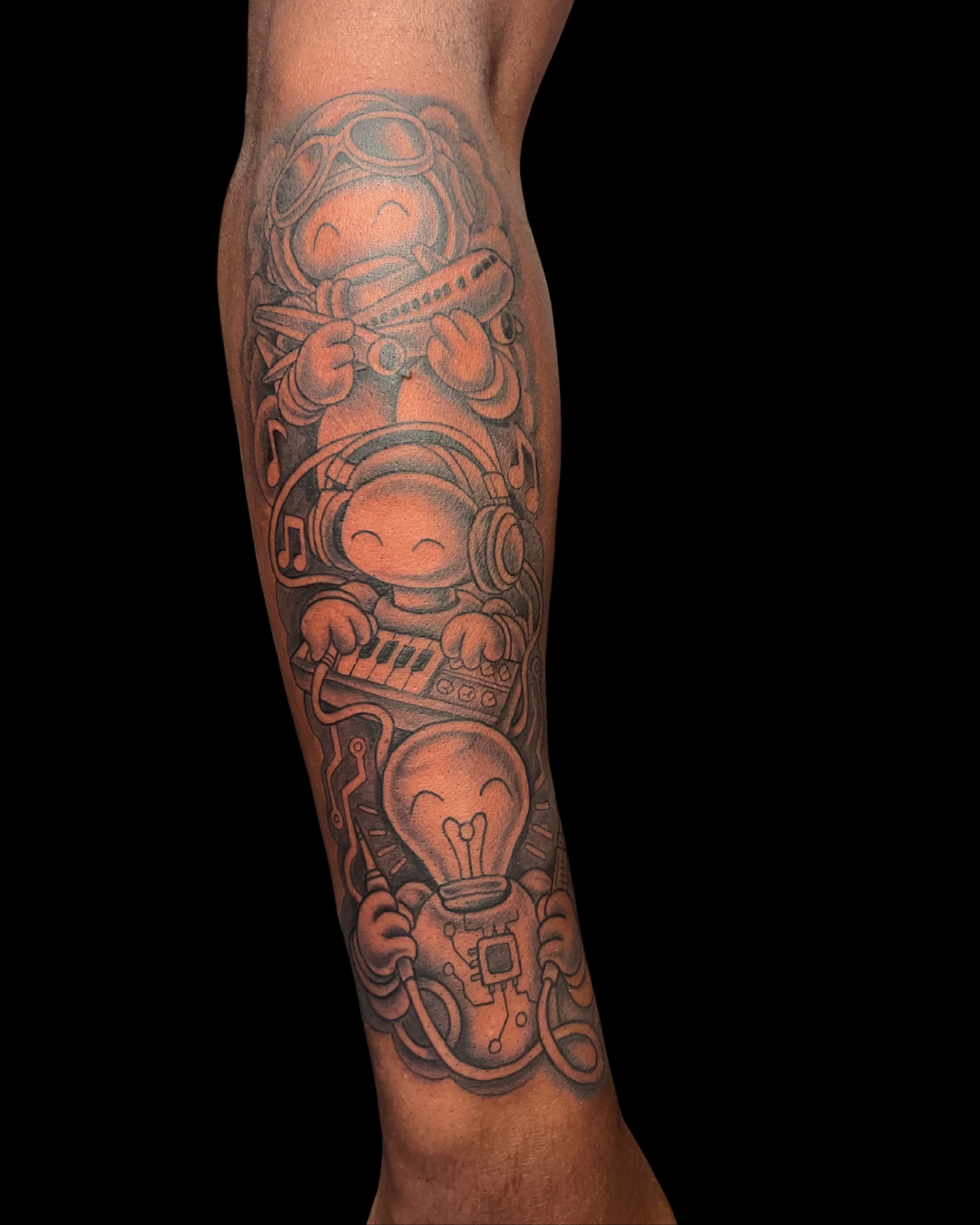 Colorful tattoo of a red rose with green leaves on someone's skin.