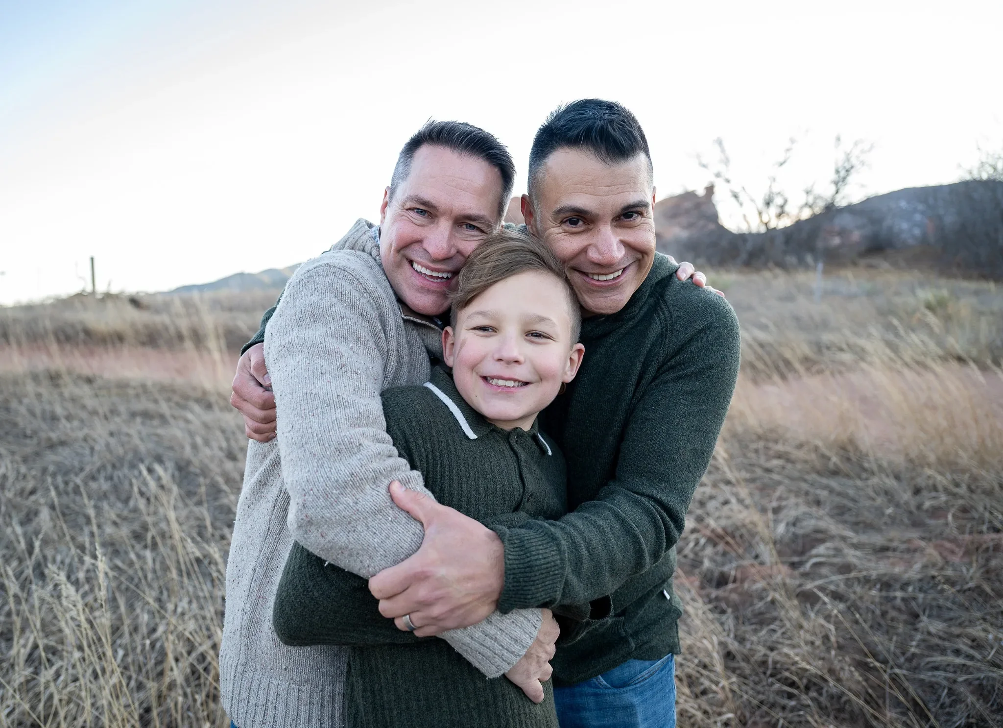 Hugs all around. Outdoor family photography session at South Valley Park Littleton Colorado.