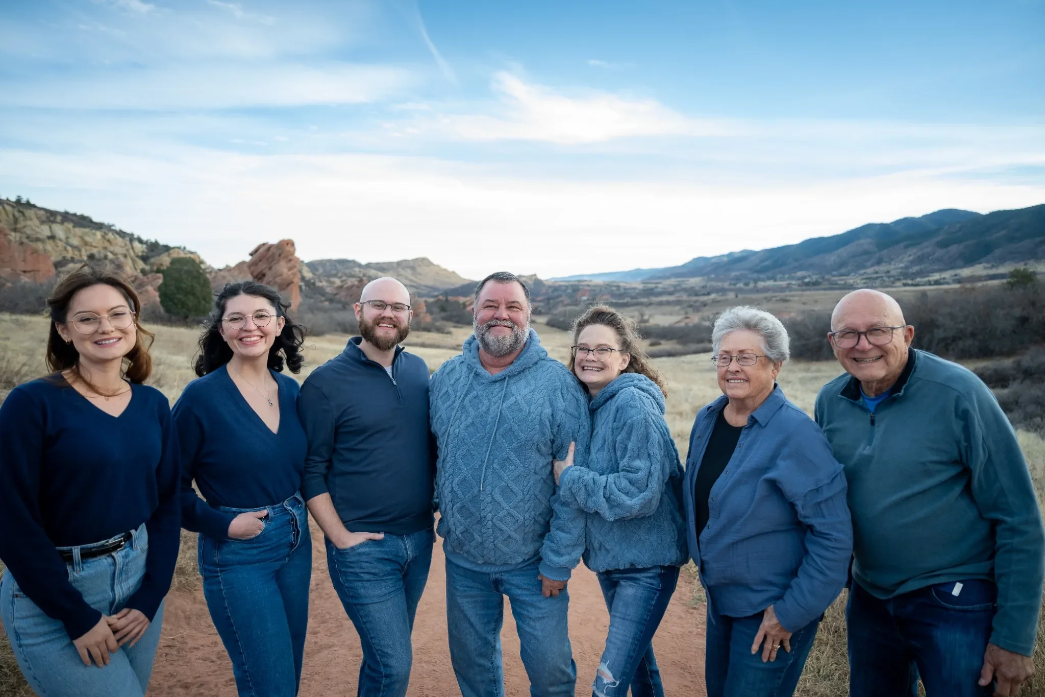Family portrait with valley views at South Valley Park in Littleton, Colorado. Relaxed, family photography captured by Ryan Kost