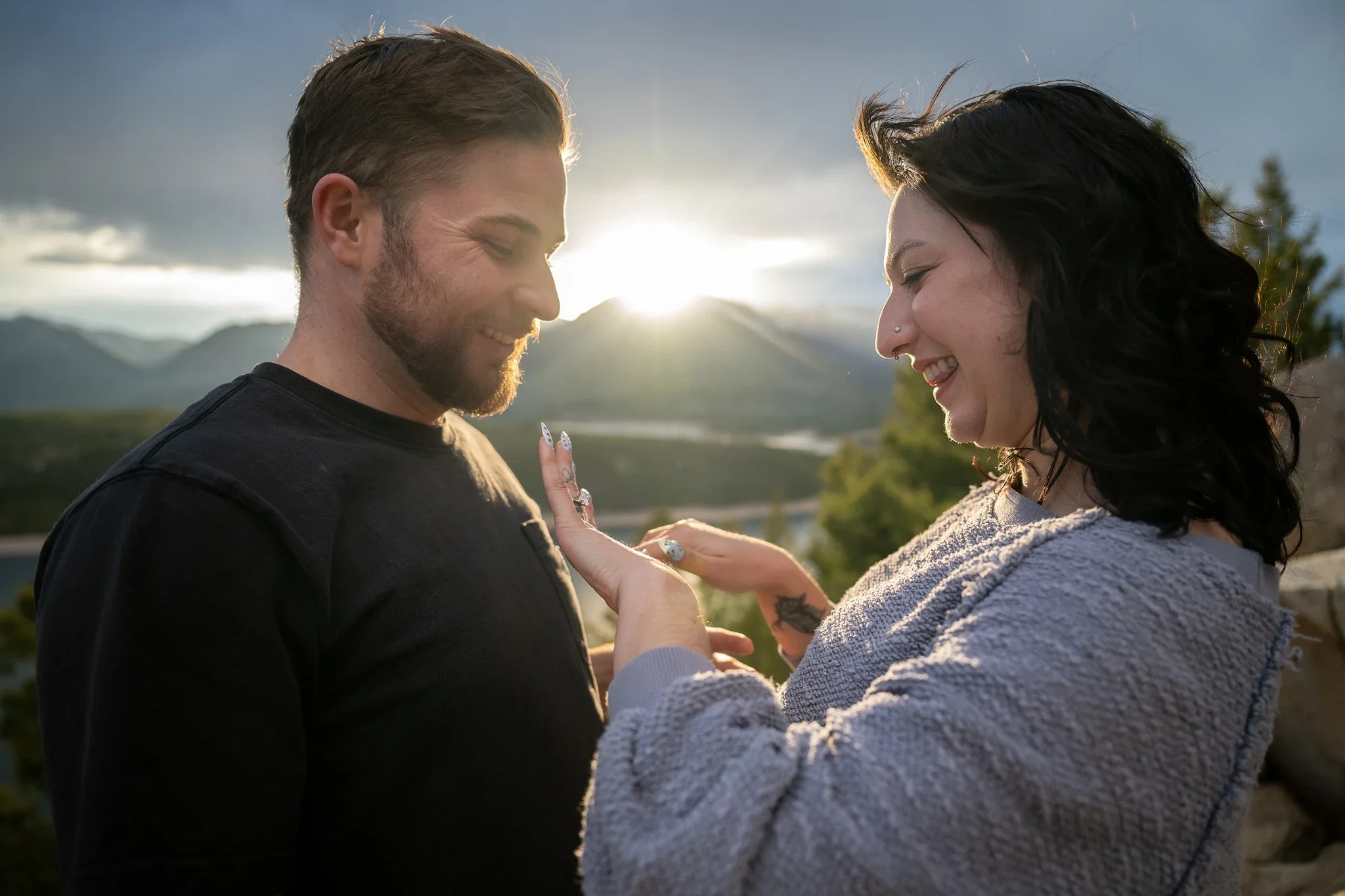 Bride to be admiring engagement ring during Sapphire Point surprise proposal in the Colorado Rockies
