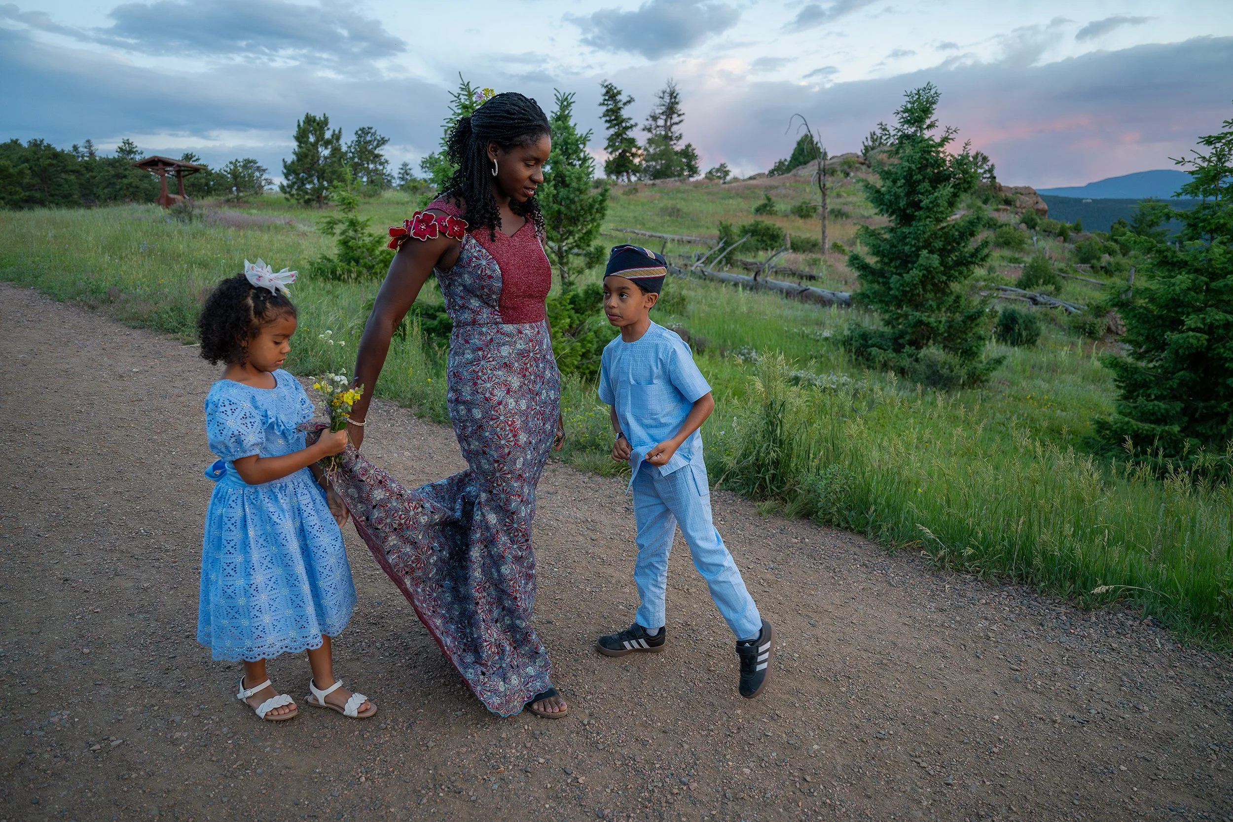 Mom walking with kids on trail at sunset in summer at Mount Falcon West Colorado. Captured naturally by Ryan Kost.