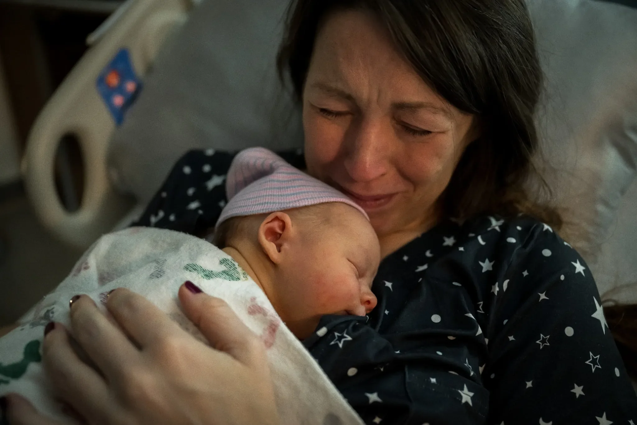 A beautiful,intimate and raw portrait of mom and her newborn son just minutes after being born at Rose Hospital in Denver, Colorado. Ryan Kost Photography