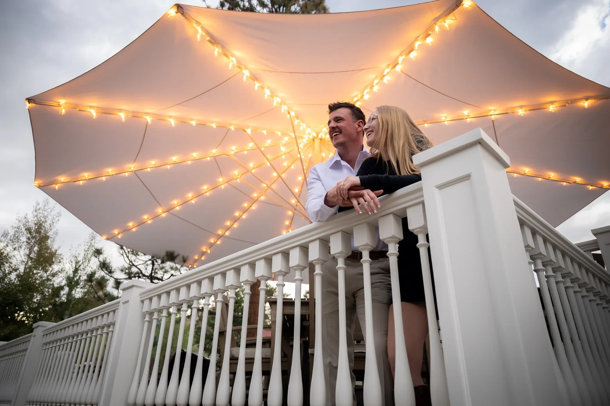 Engagement portrait on the patio outside the history Stanley Hotel in Estes Park, Colorado. Ryan Kost Photography