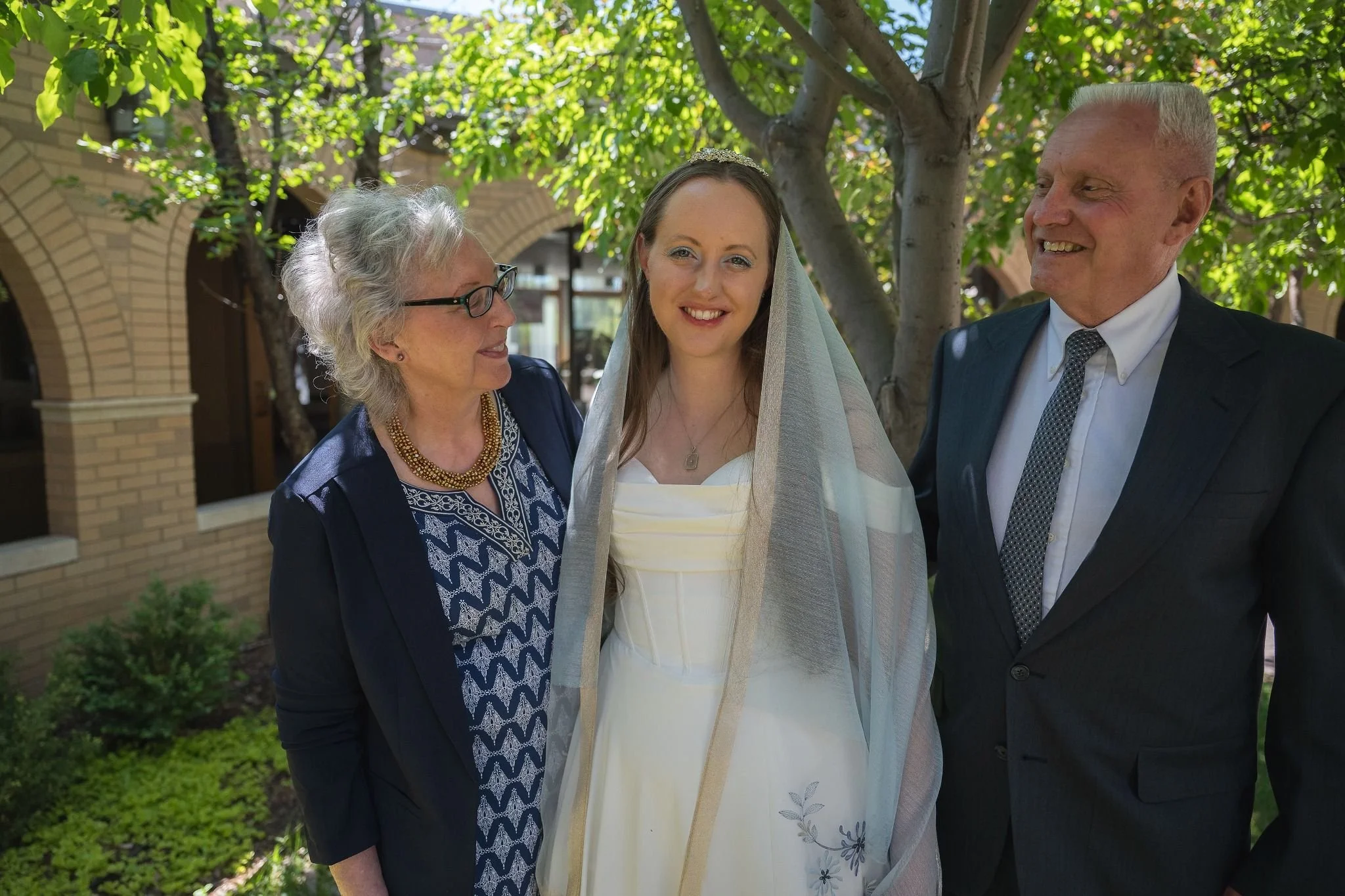 Proud mom and dad of the bride. Timeless elopement moments in Arvada, Colorado—moody chapel light and cinematic emotion captured by Colorado elopement photographer Ryan Kost.