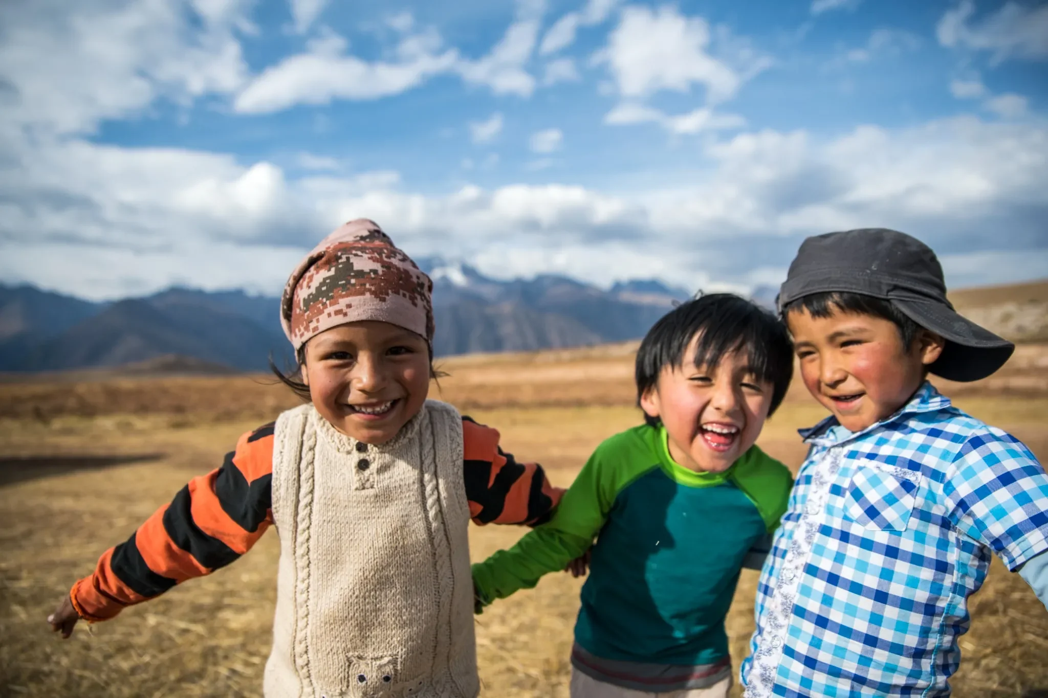 Cousins-Giggling-Maras-Peru-Ryan-Kost-Photography.webp