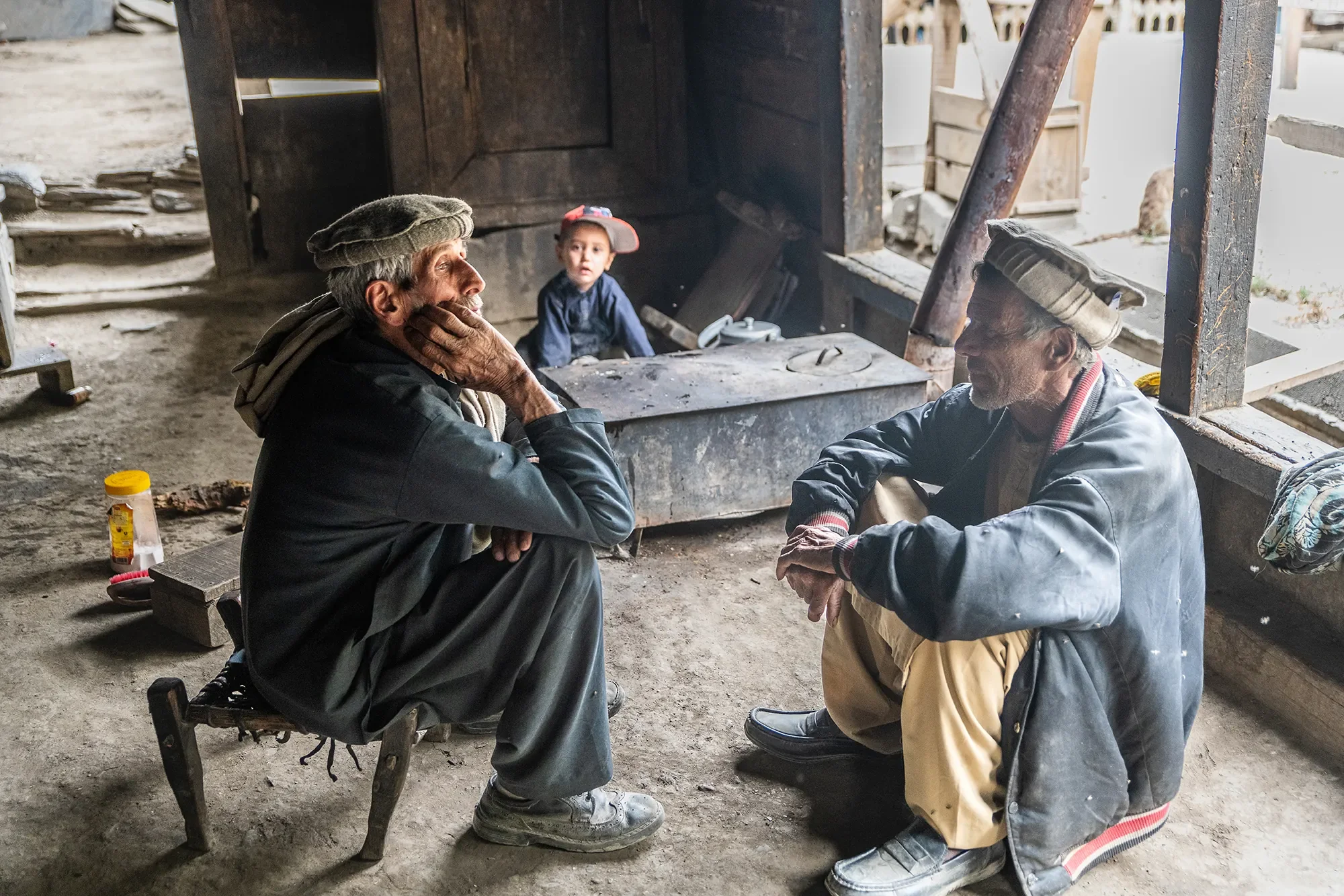 Men chatting in oldest home in Balanguru kalash (1).webp