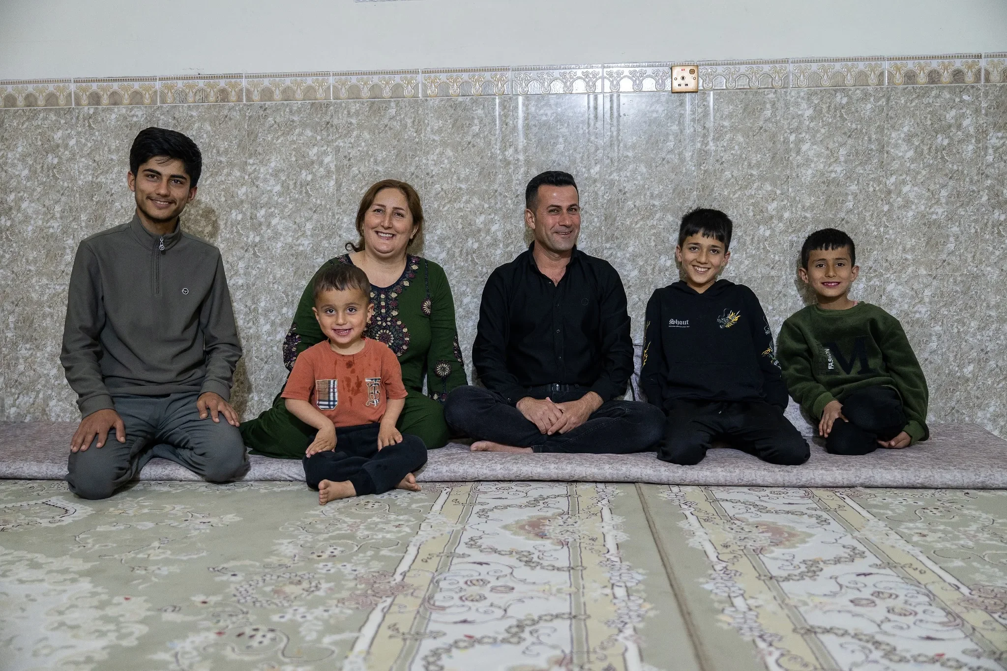 Jawad-Meer-Family-Portrait-In-Home-Soran-Kurdistan-Iraq-Ryan-Kost-Photography.webp