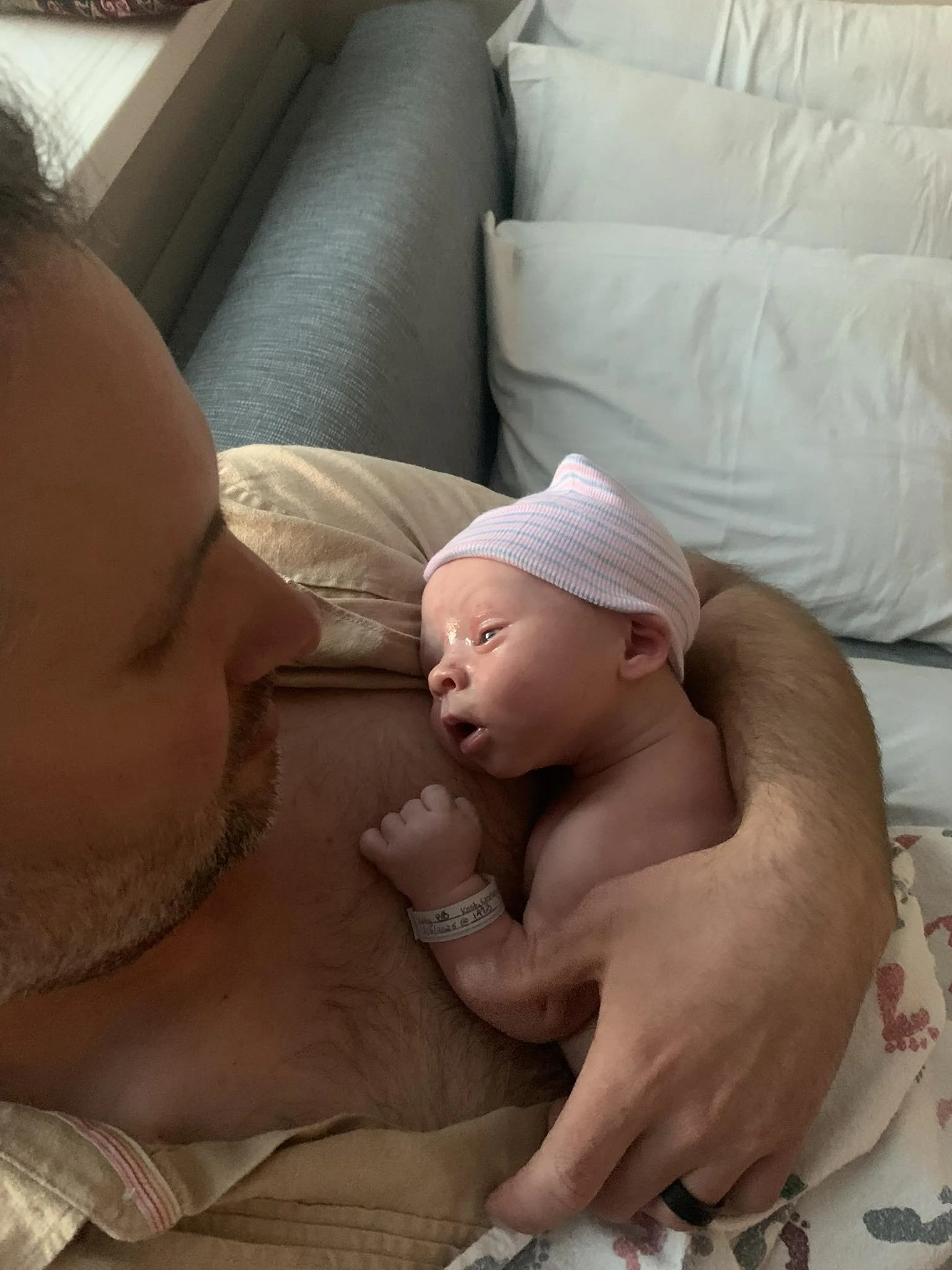 Photographer-Ryan-Kost-Holding-Newborn-Son-Portrait.jpg