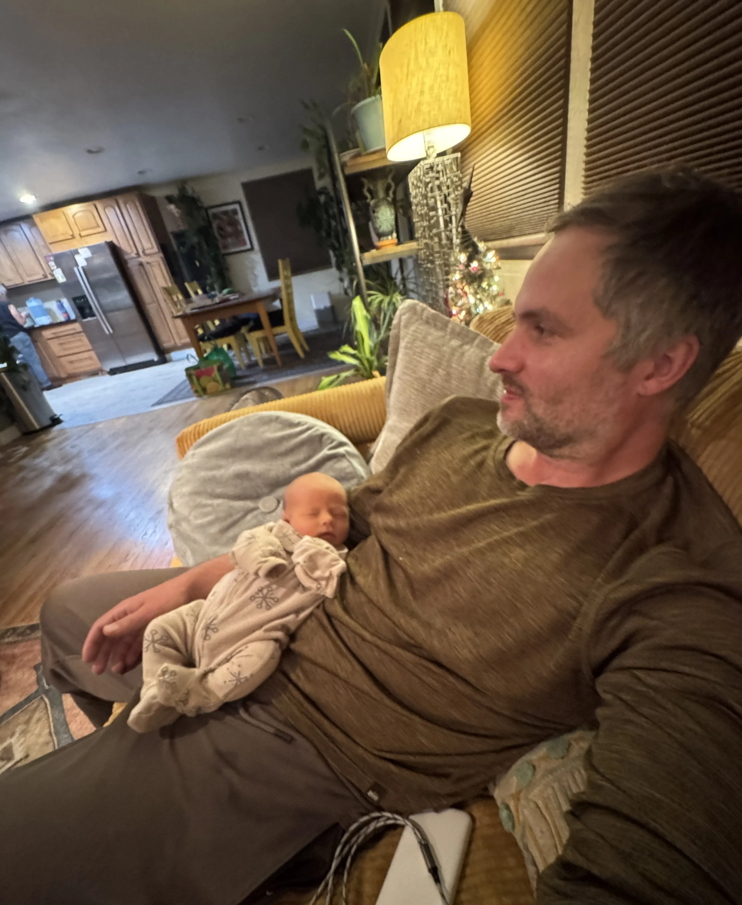 Ryan-Kost-Portrait-With-Newborn-Son.jpg