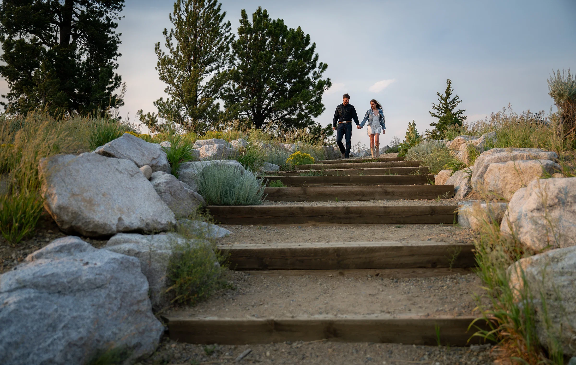 Newlywed couple walking through the rocky landscape near Twin Lakes during their Colorado elopement.