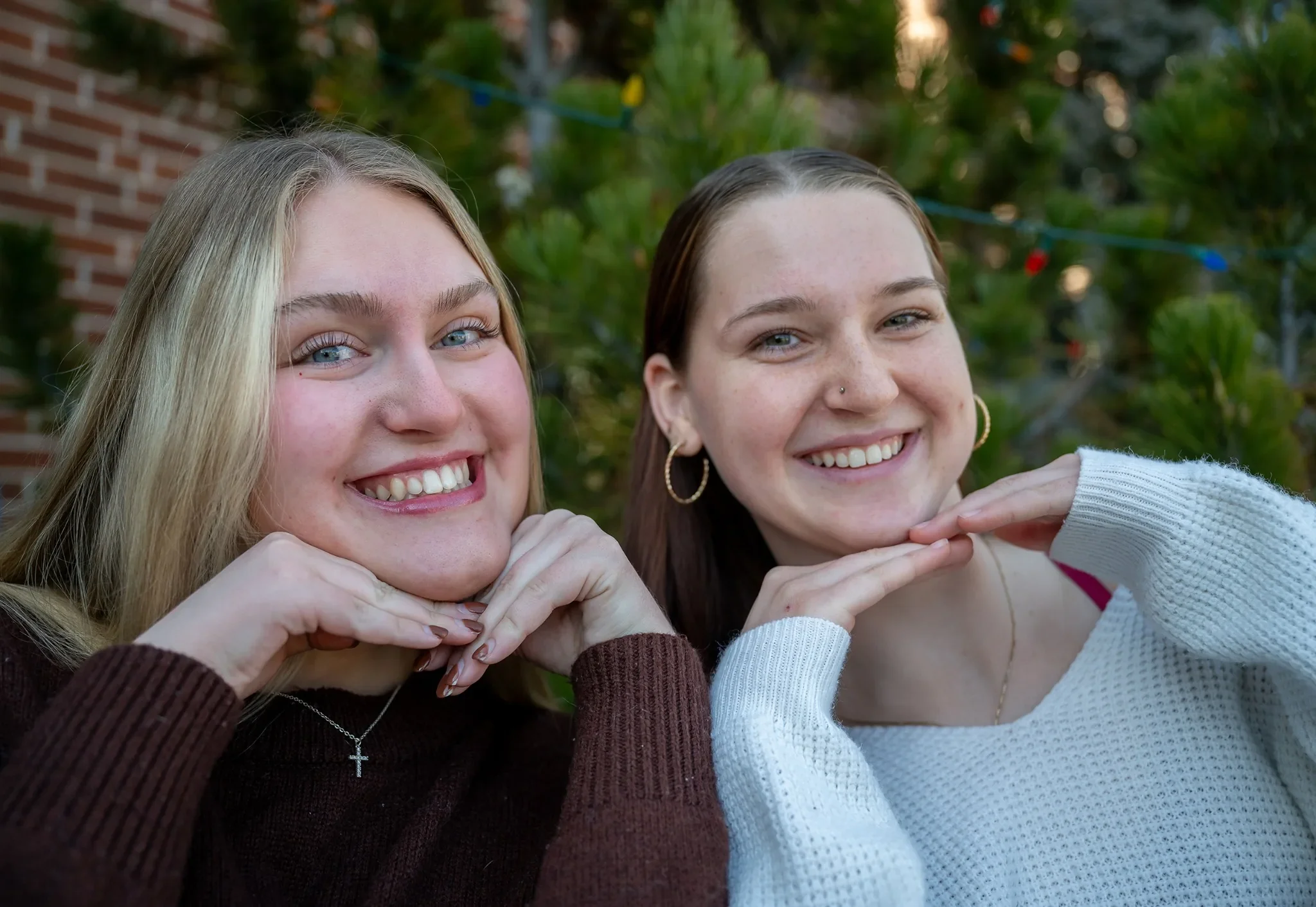 Teenage cousins natural, fun portrait captured during a Denver in home family photo session by Ryan Kost.