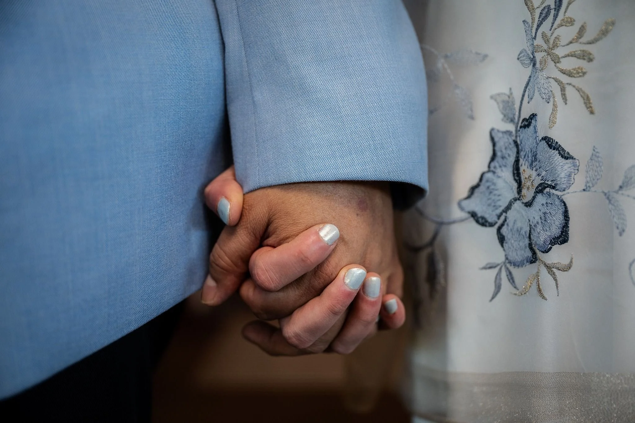 Holding hands. A deeply heartfelt and dramatic elopement at Spirit of Christ Church in Colorado, styled with natural light and an intimate, soulful lens by Ryan Kost.