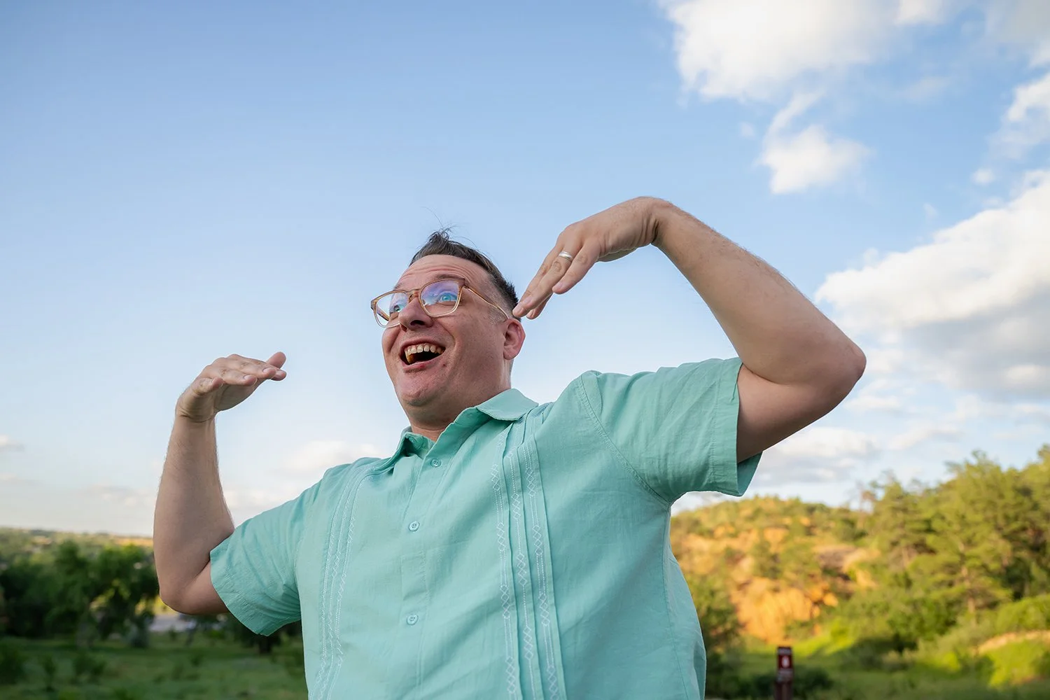 Behind the scenes of dad being silly and making faces for his kiddos. Fun, natural summer family photography at Red Rock Canyon Open Space captured by Ryan Kost.