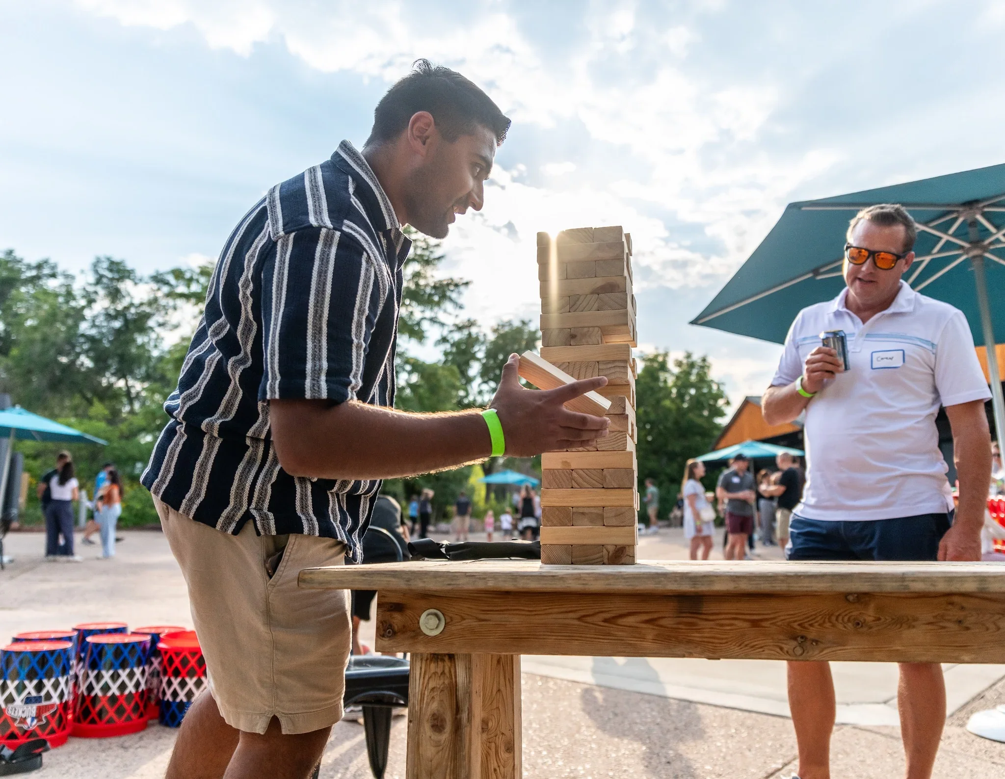Documentary-style corporate event photography from with fun & games during a Summer party at the Denver Zoo captured by Ryan Kost Photography