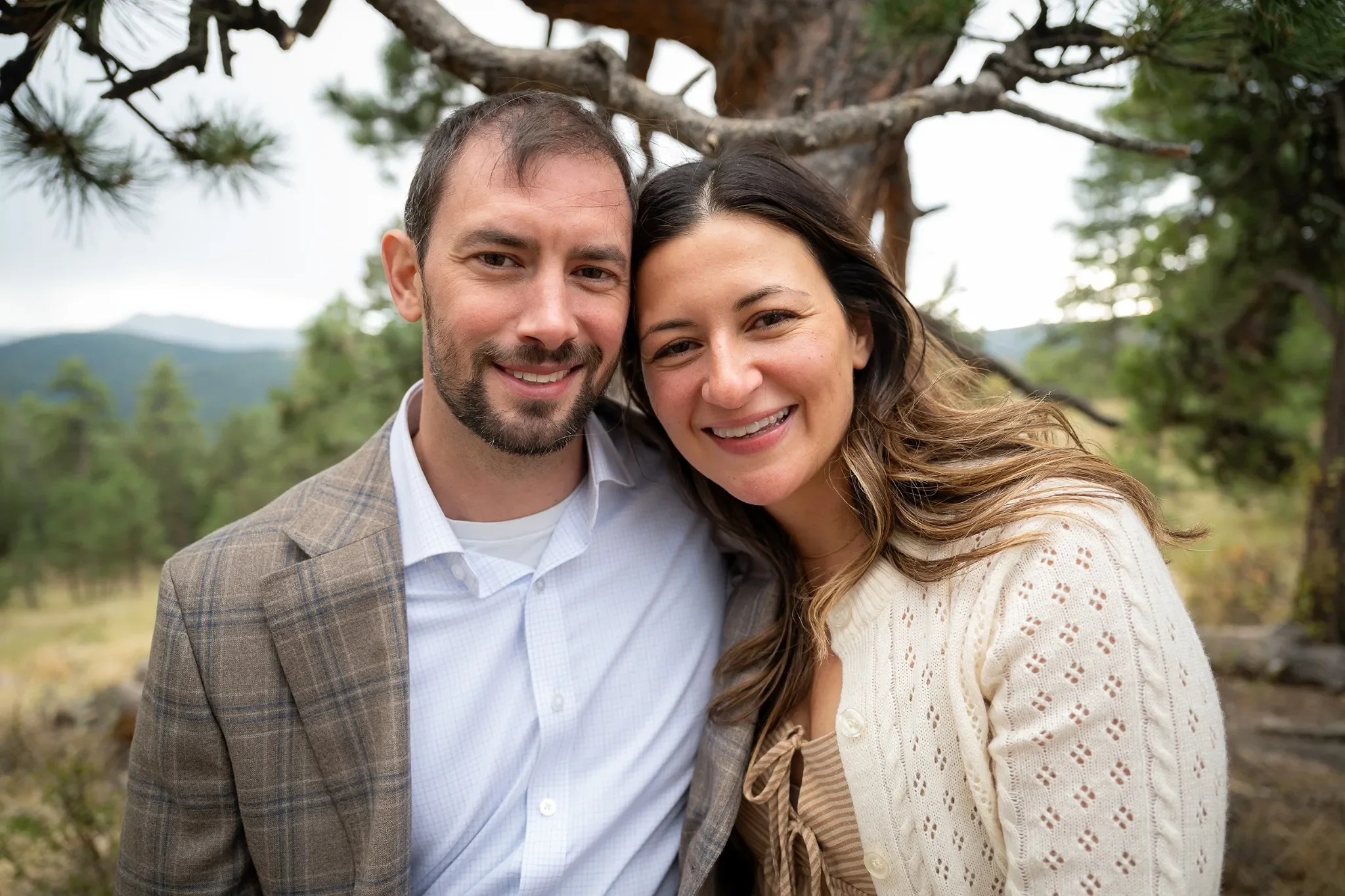 Beautiful close up natural couples portrait during a relaxed outdoor family photo session at Mount Falcon West Trailhead. Ryan Kost Photography.