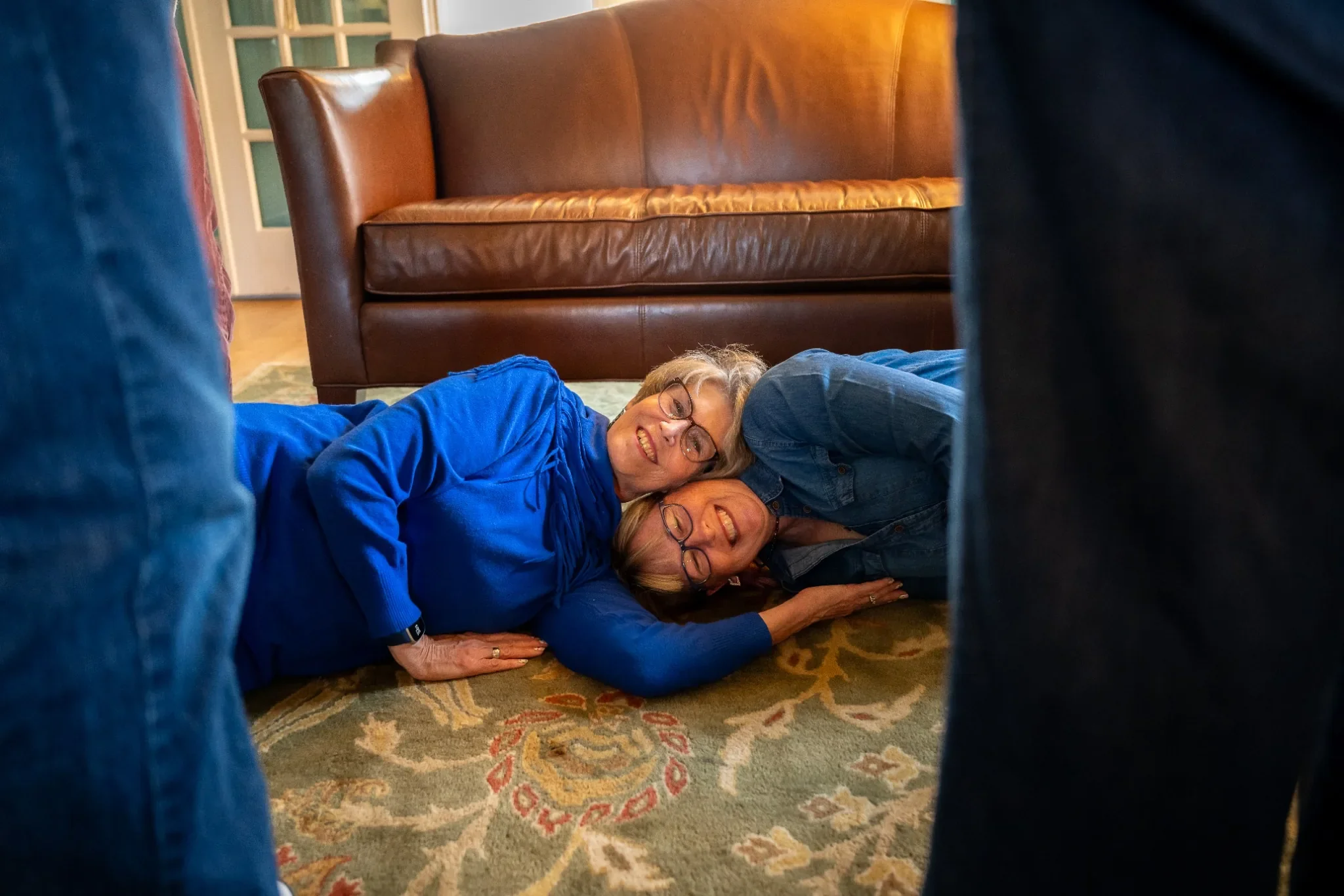 Quirky, joyful family portrait in home in Denver, Colrodo during holidays captured by Ryan Kost.