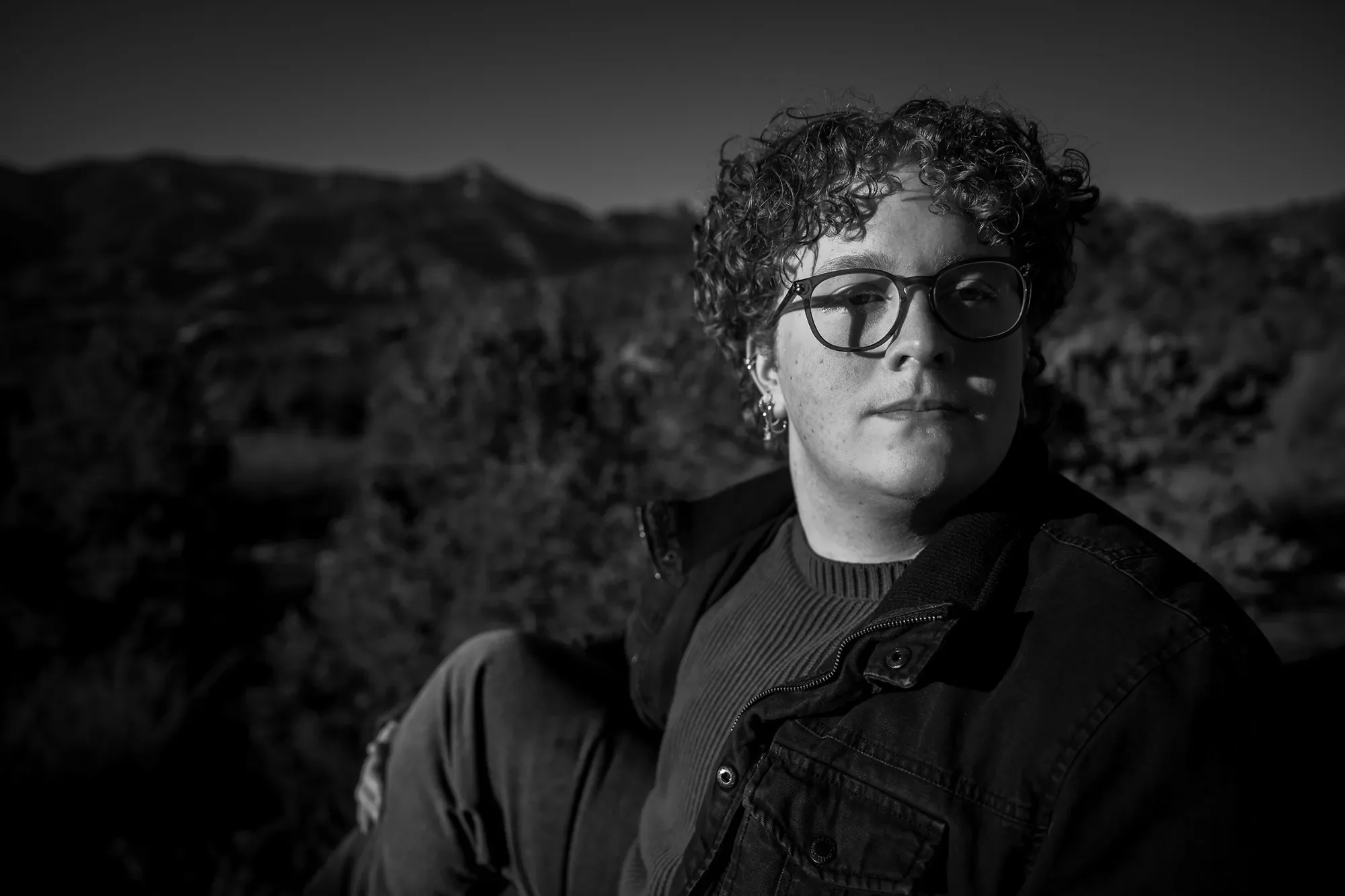 Black and white high school senior portrait taken during a winter photo session at Garden of the Gods in Colorado Springs. Ryan Kost Photography