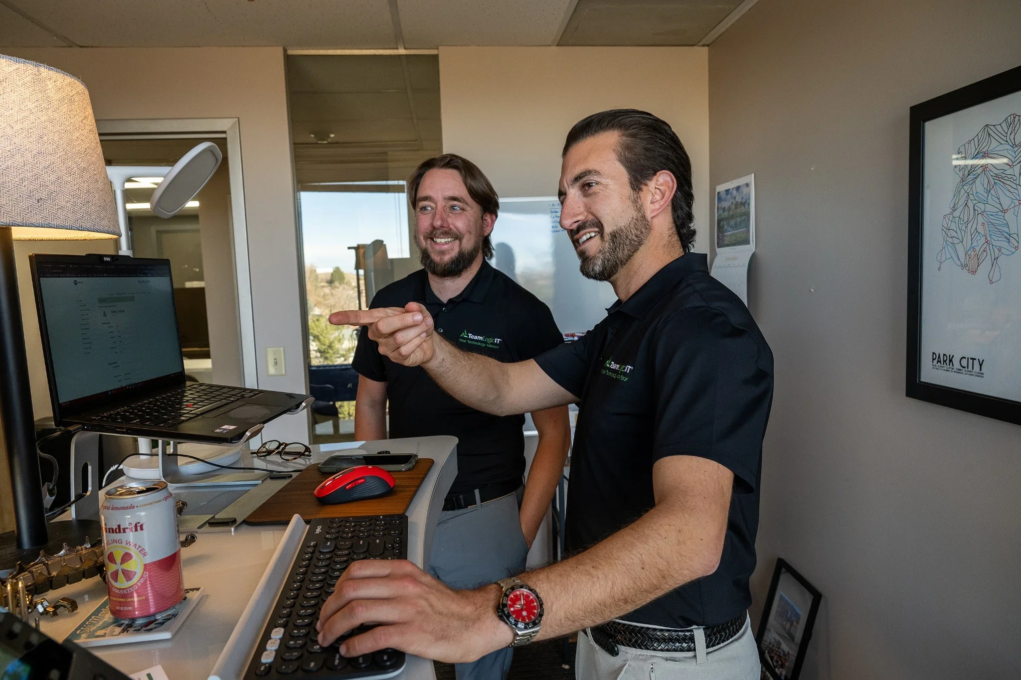 Business owners working in office space in Denver, Colorado.  Natural, relaxed, professional portrait photography captured by Ryan Kost