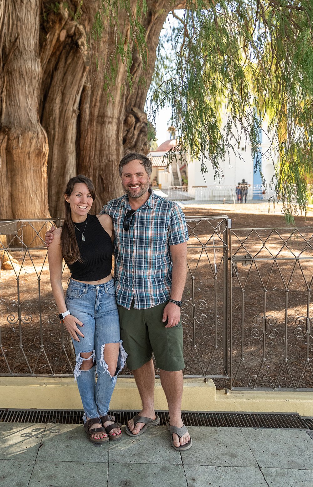 Ryan Kost and his wife Lindsay standing in front the Tule Tree, the widest tree in the world in Oaxaca, Mexico.