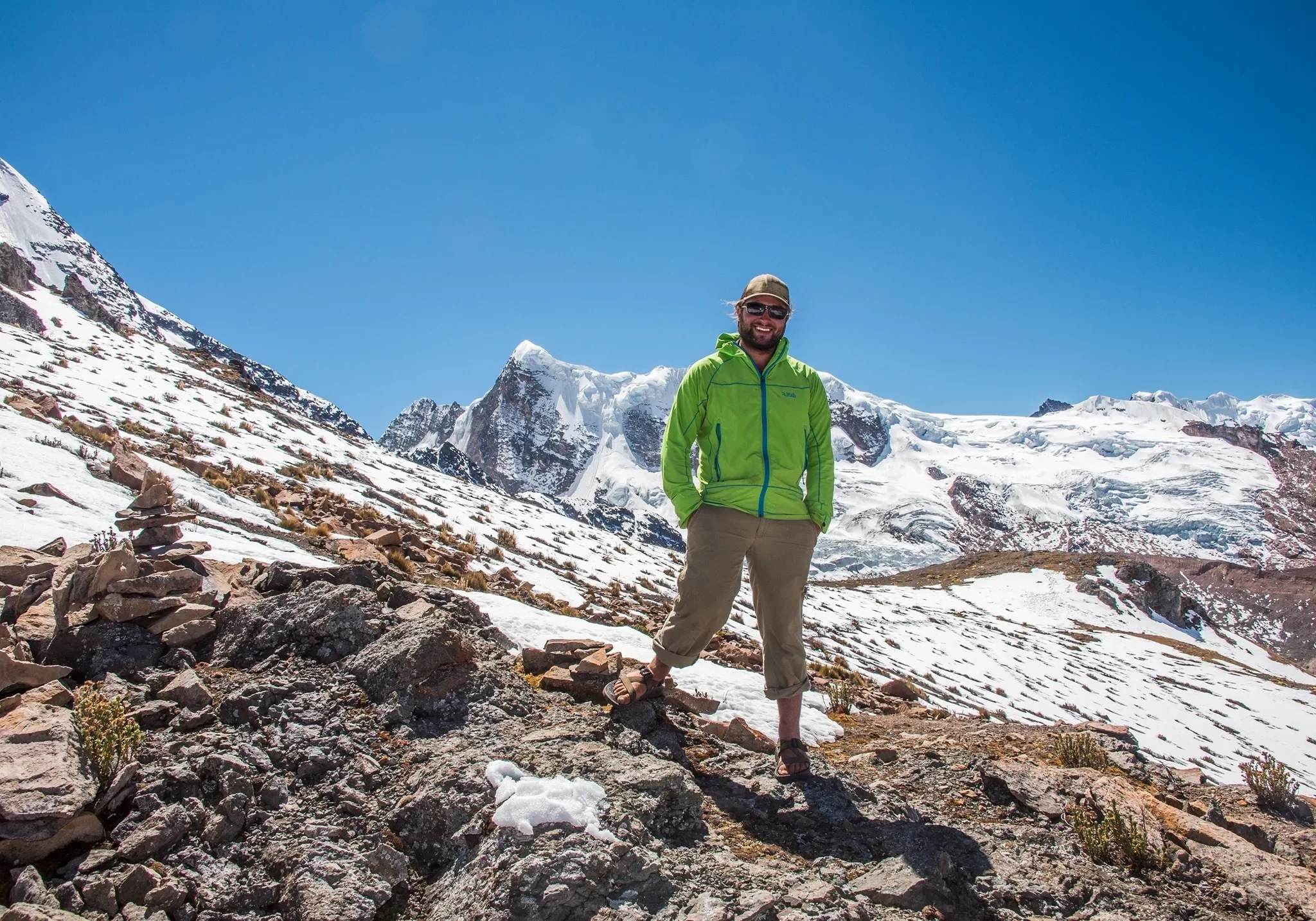 Denver, Colorado portrait photographer Ryan Kost stands in Andes Mountains in Peru where has guided trips for 15+ years.