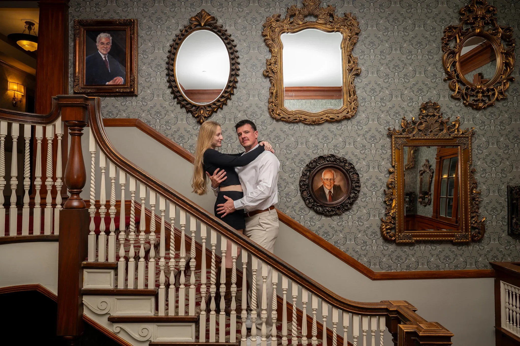 Engagement portrait on the ornate staircase inside the Stanley Hotel in Estes Park